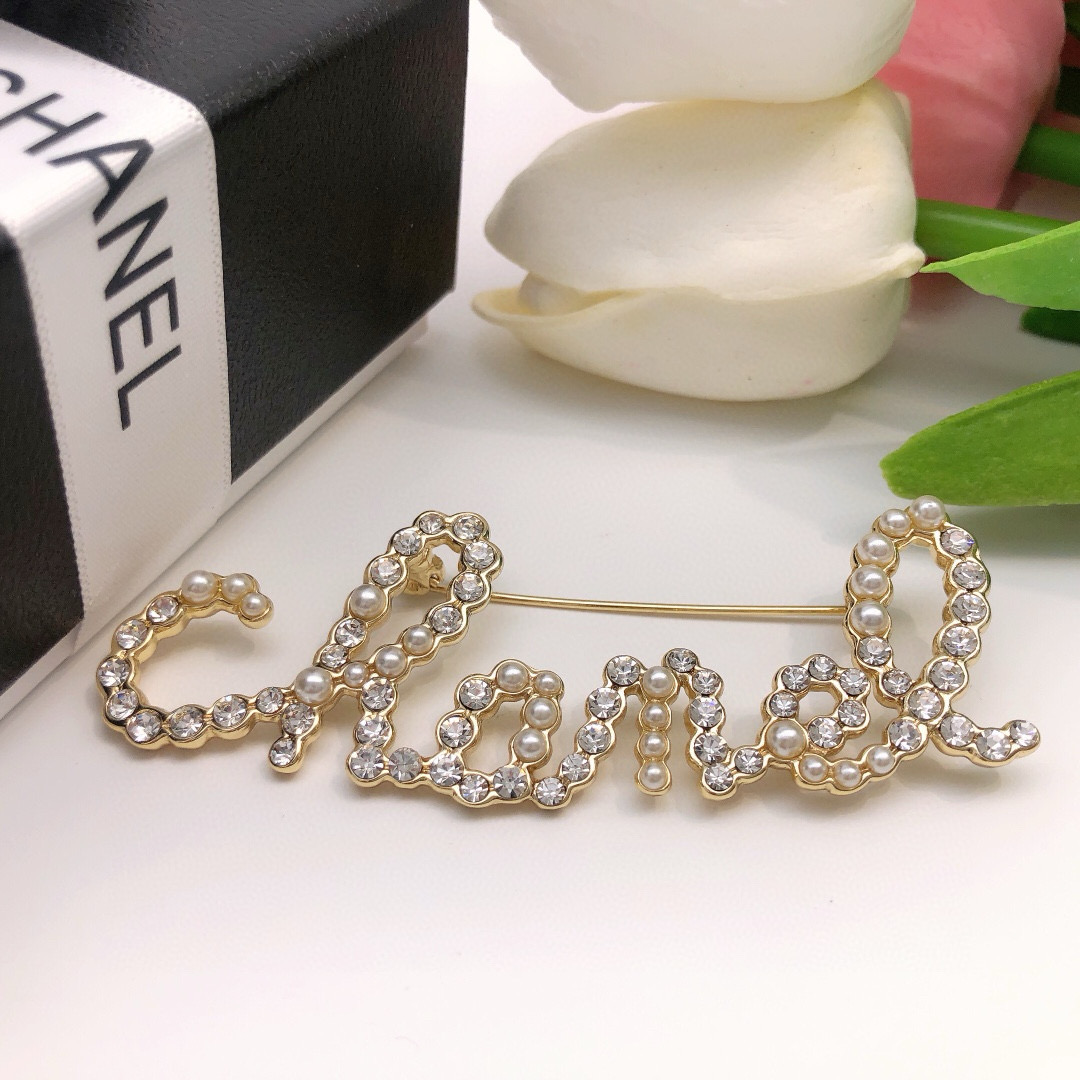 Chanel Cursive Script Logo Brooch brooch gold-tone metal clear crystal white faux pearl 6cm width