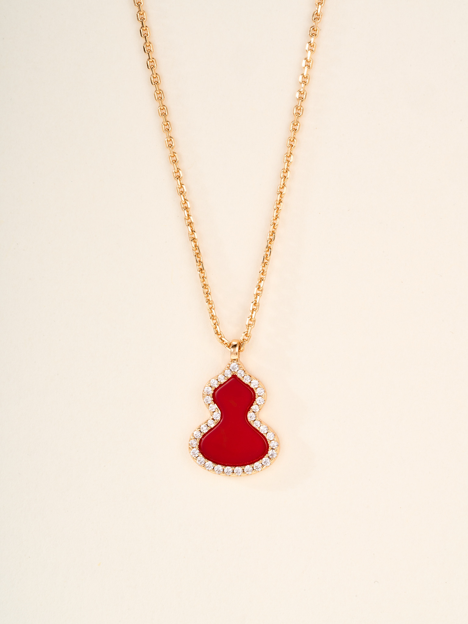 Qeelin Wulu necklace Rose gold metal with red carnelian white mother-of-pearl green jade and clear diamond accents white gold metal with green jade and clear diamond accents 11 2 14 1mm pendant