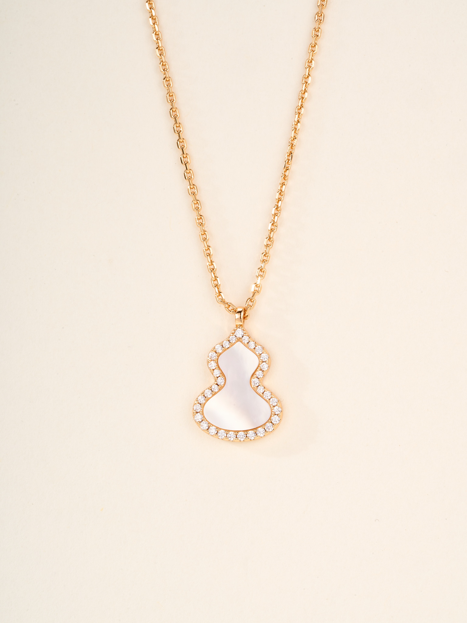 Qeelin Wulu necklace Rose gold metal with red carnelian white mother-of-pearl green jade and clear diamond accents white gold metal with green jade and clear diamond accents 11 2 14 1mm pendant