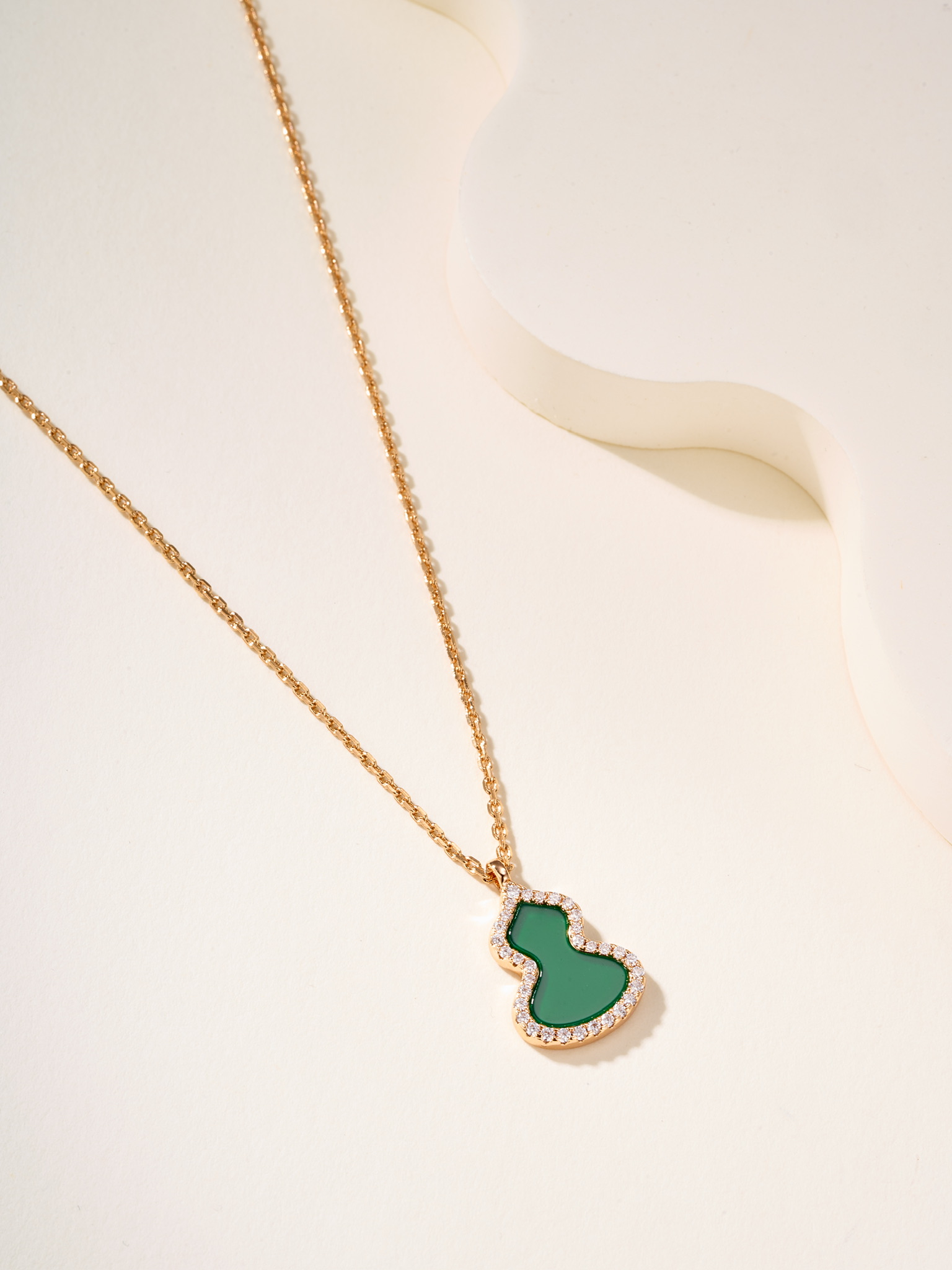 Qeelin Wulu necklace Rose gold metal with red carnelian white mother-of-pearl green jade and clear diamond accents white gold metal with green jade and clear diamond accents 11 2 14 1mm pendant
