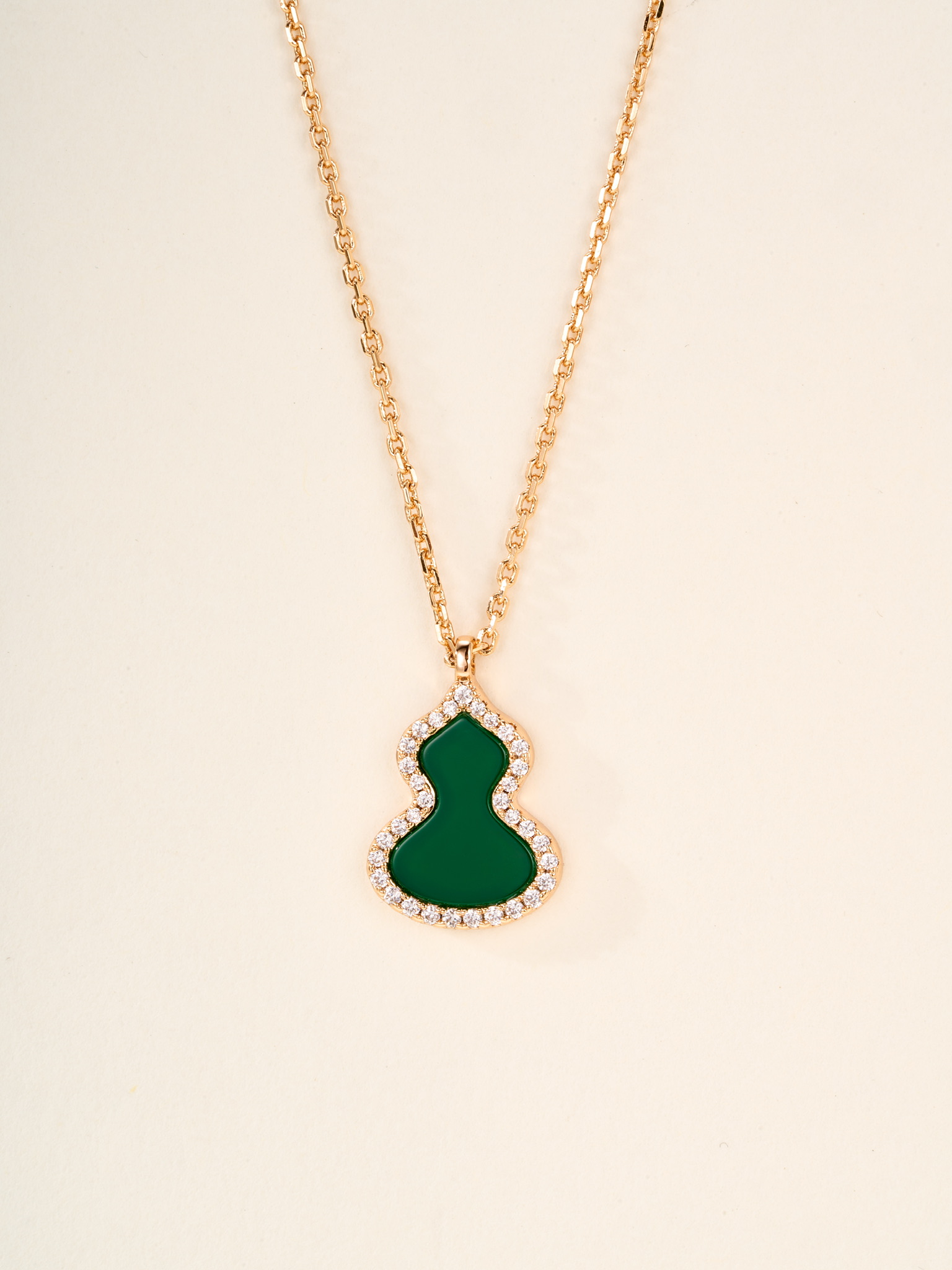 Qeelin Wulu necklace Rose gold metal with red carnelian white mother-of-pearl green jade and clear diamond accents white gold metal with green jade and clear diamond accents 11 2 14 1mm pendant