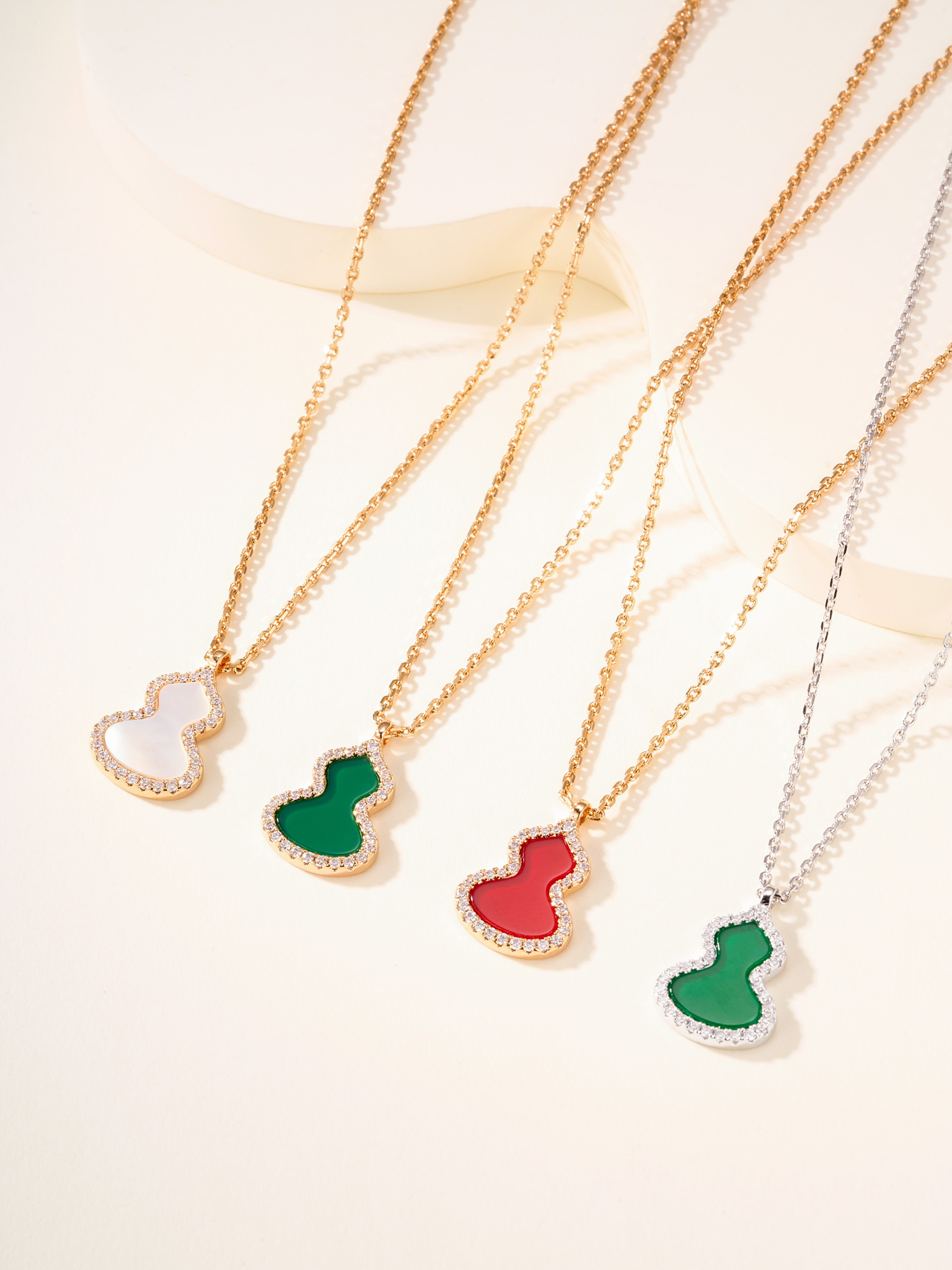 Qeelin Wulu necklace Rose gold metal with red carnelian white mother-of-pearl green jade and clear diamond accents white gold metal with green jade and clear diamond accents 11 2 14 1mm pendant