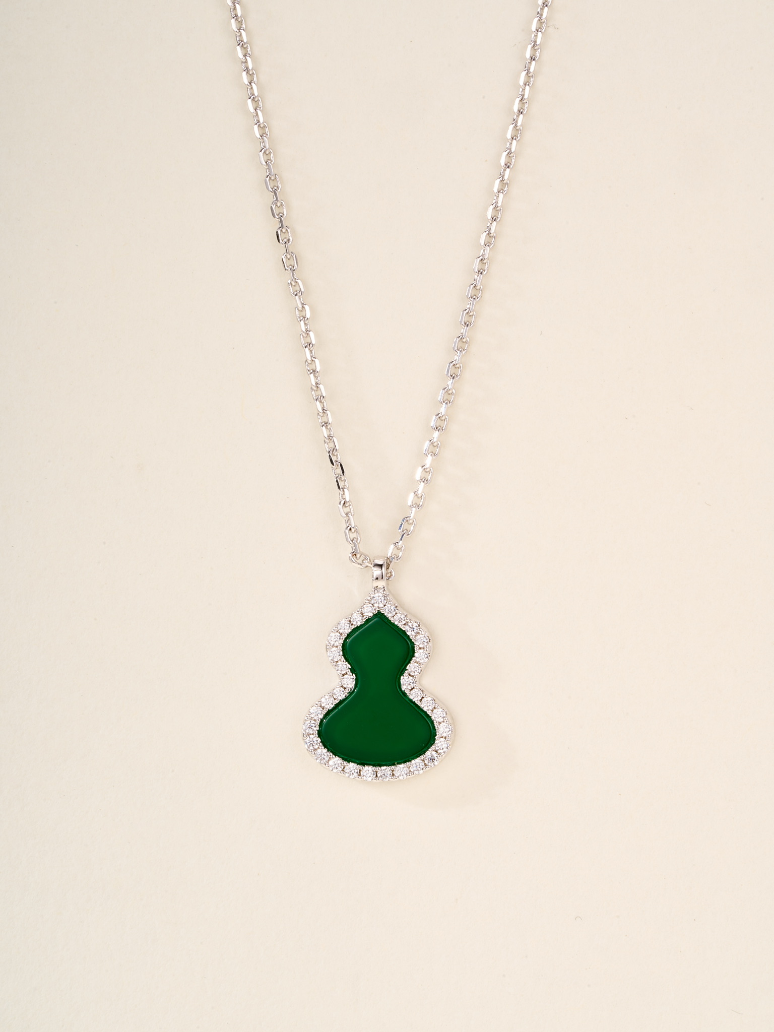 Qeelin Wulu necklace Rose gold metal with red carnelian white mother-of-pearl green jade and clear diamond accents white gold metal with green jade and clear diamond accents 11 2 14 1mm pendant