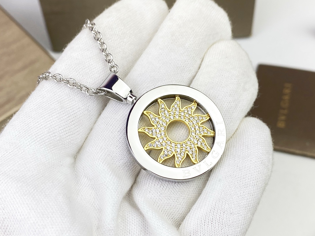 Bvlgari Bvlgari Bvlgari Sun Pendant necklace 18k white gold chain and bezel 18k yellow gold sun motif clear pave diamonds 65cm