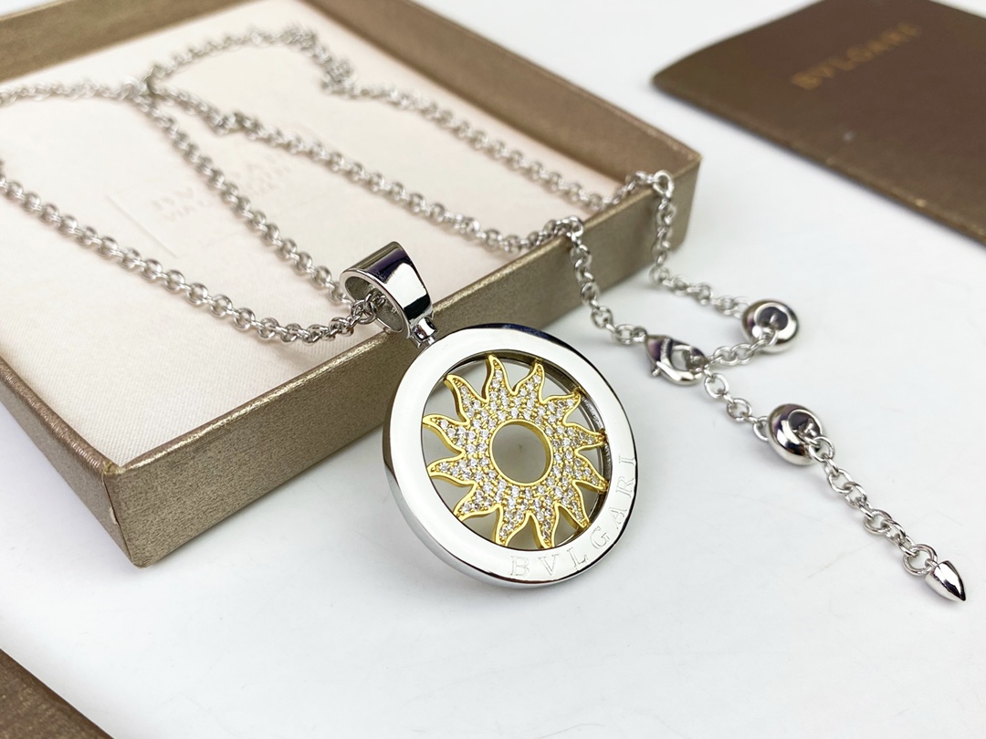 Bvlgari Bvlgari Bvlgari Sun Pendant necklace 18k white gold chain and bezel 18k yellow gold sun motif clear pave diamonds 65cm