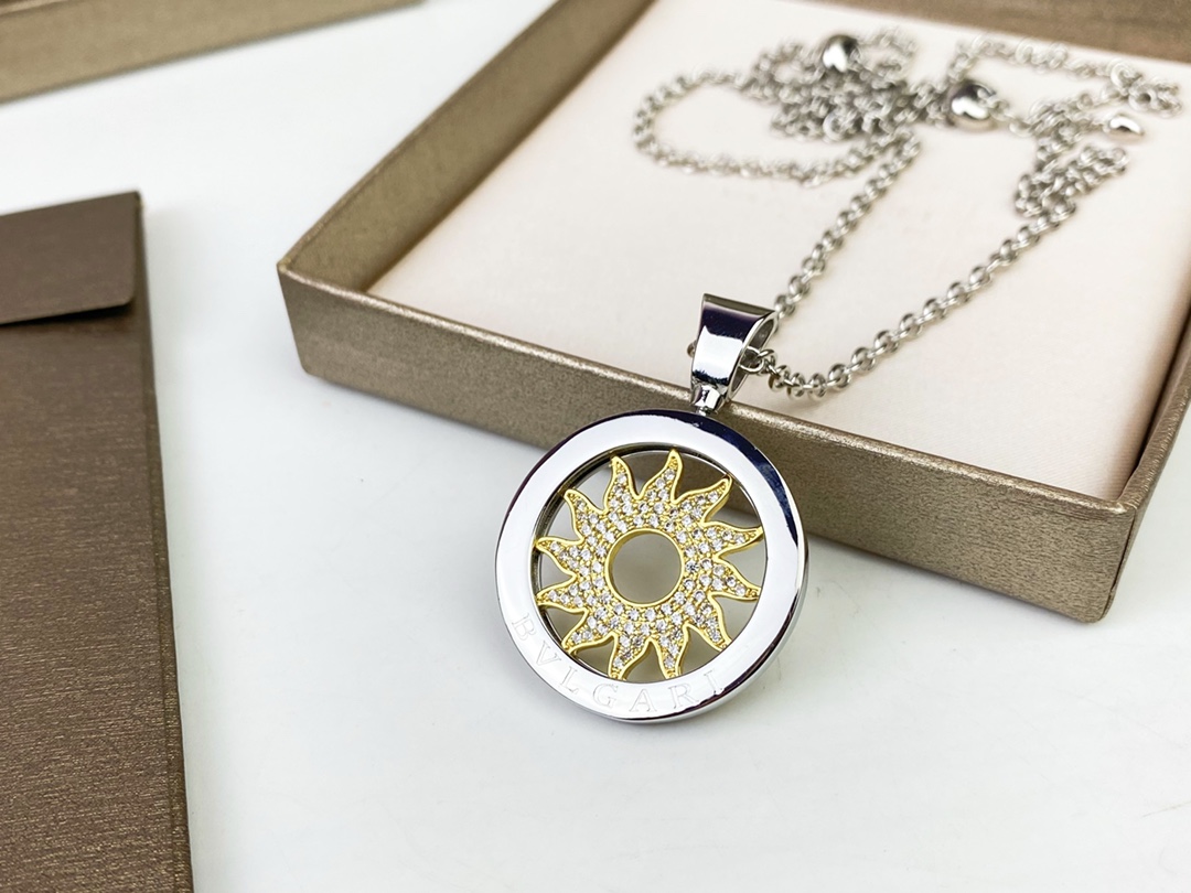 Bvlgari Bvlgari Bvlgari Sun Pendant necklace 18k white gold chain and bezel 18k yellow gold sun motif clear pave diamonds 65cm