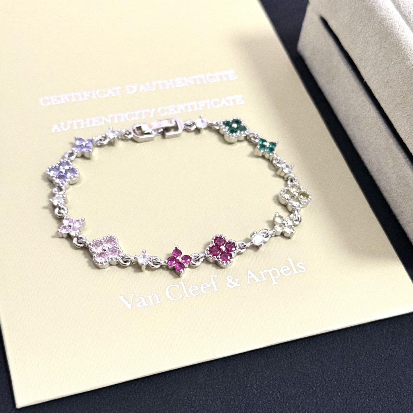 Van Cleef Arpels Alhambra bracelet Silver-toned metal with multicolor gemstones green yellow red pink purple and clear diamond accents 17cm