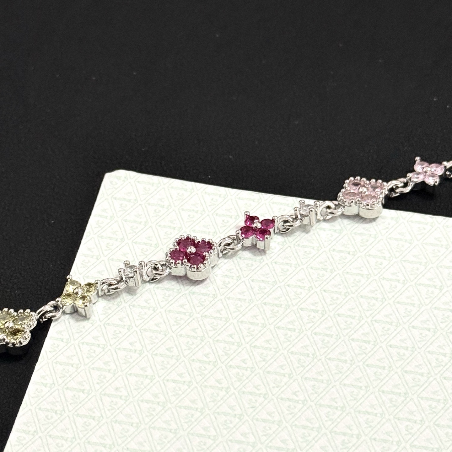 Van Cleef Arpels Alhambra bracelet Silver-toned metal with multicolor gemstones green yellow red pink purple and clear diamond accents 17cm