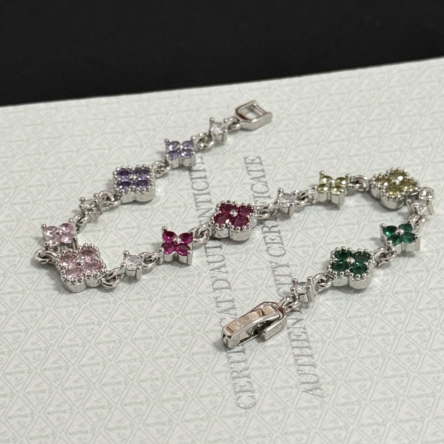 Van Cleef Arpels Alhambra bracelet Silver-toned metal with multicolor gemstones green yellow red pink purple and clear diamond accents 17cm