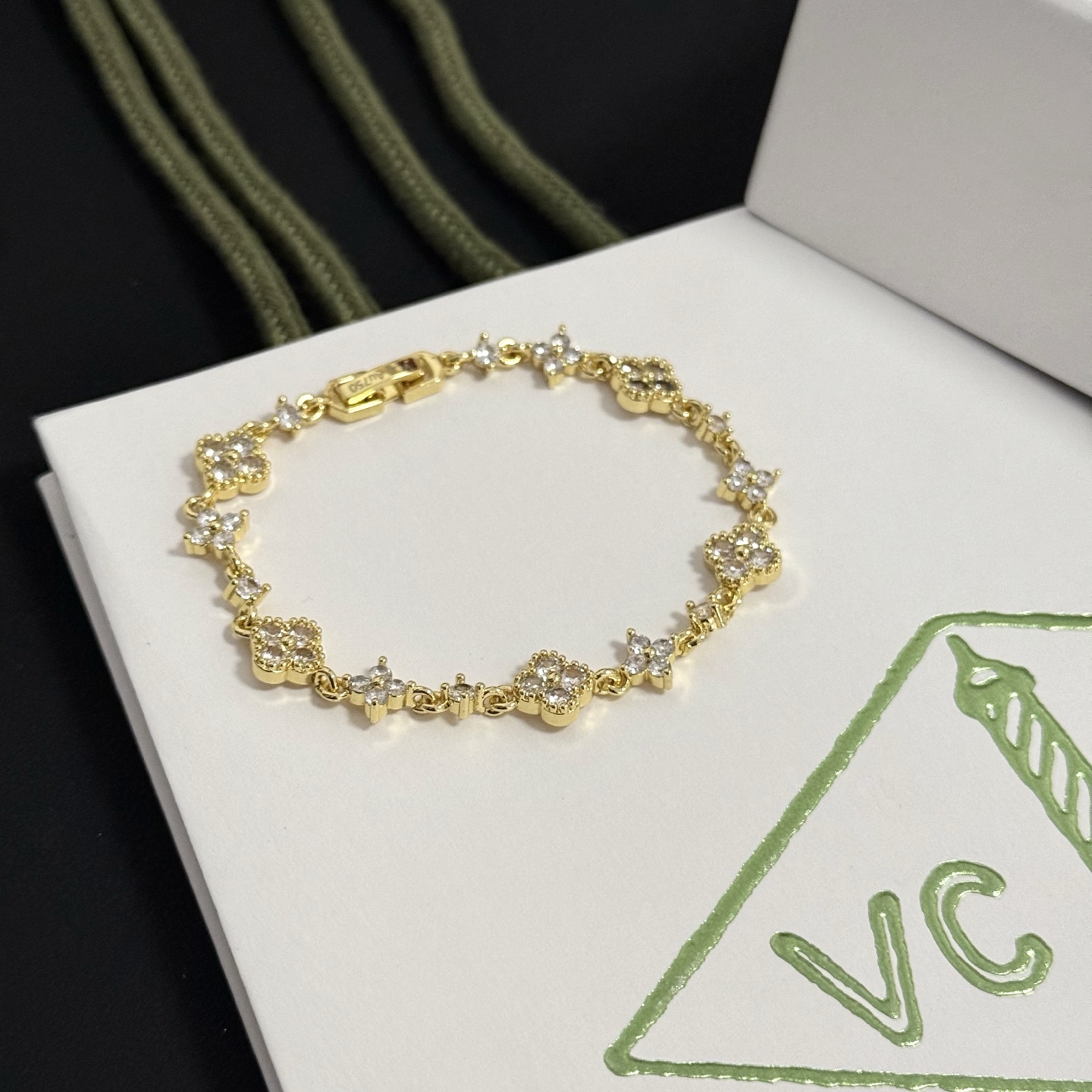 Van Cleef Arpels Alhambra bracelet gold-tone metal with clear diamond-like stones 17cm