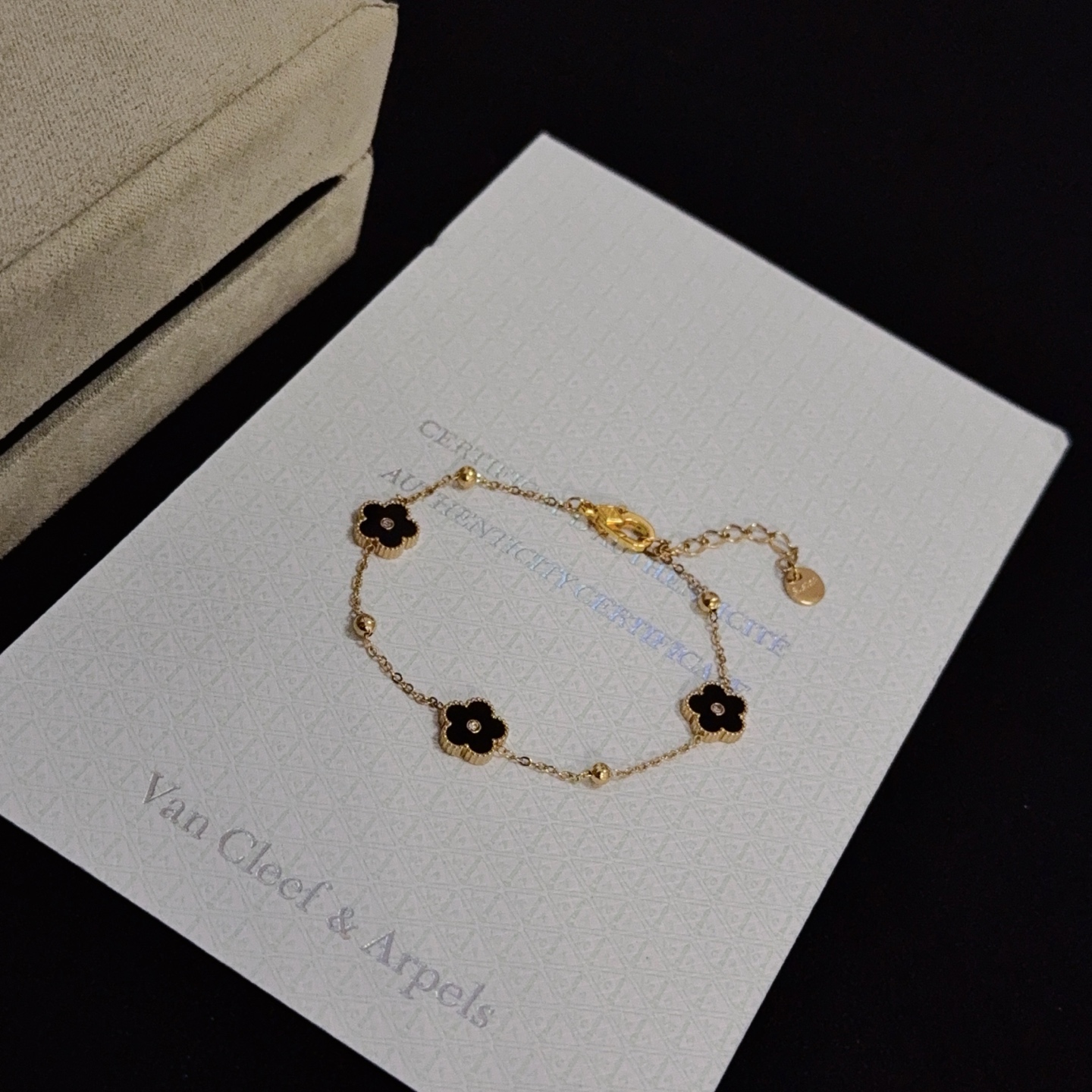 Van Cleef Arpels Alhambra bracelet yellow gold metal black onyx clover motifs clear diamond accents 17cm with 2cm extension chain