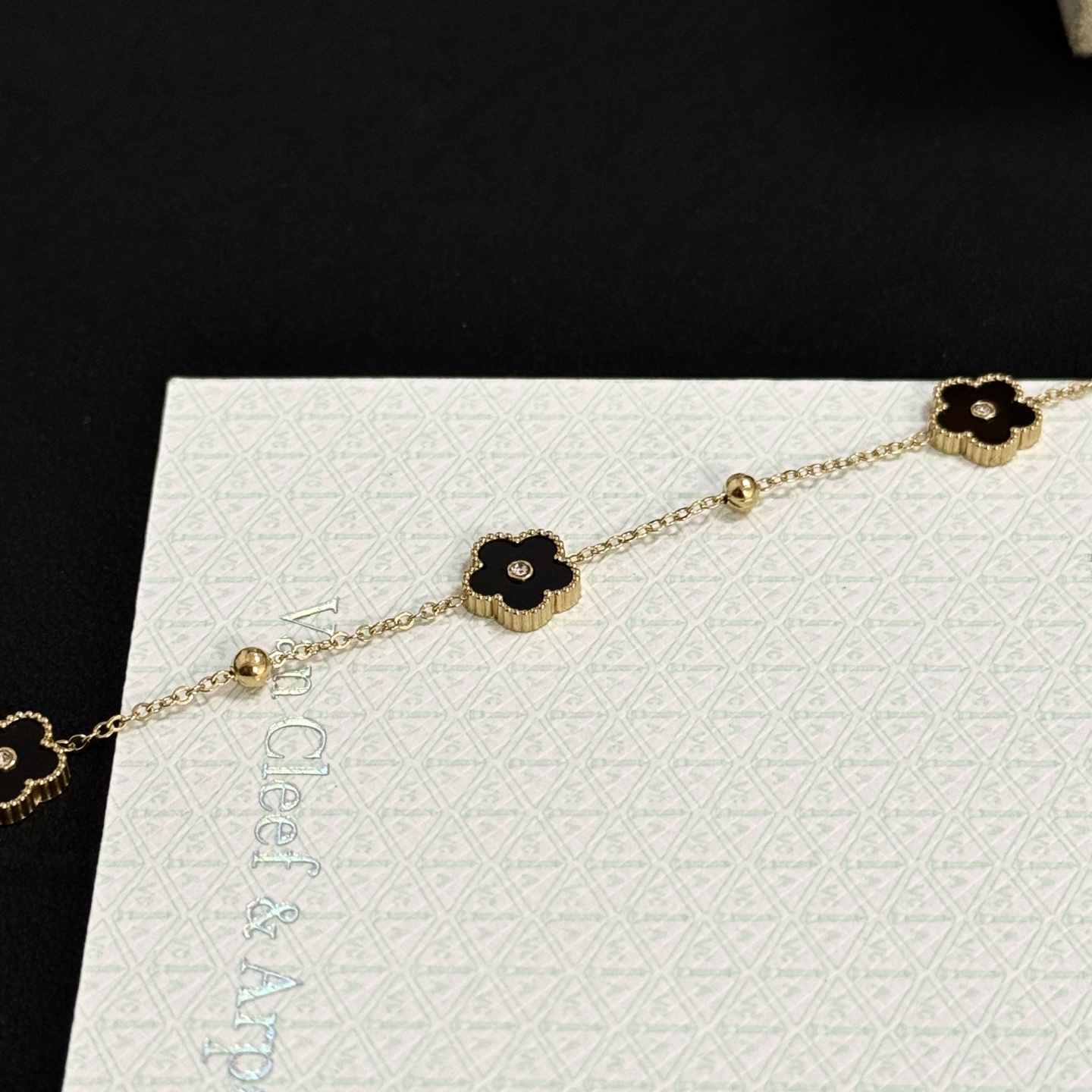 Van Cleef Arpels Alhambra bracelet yellow gold metal black onyx clover motifs clear diamond accents 17cm with 2cm extension chain