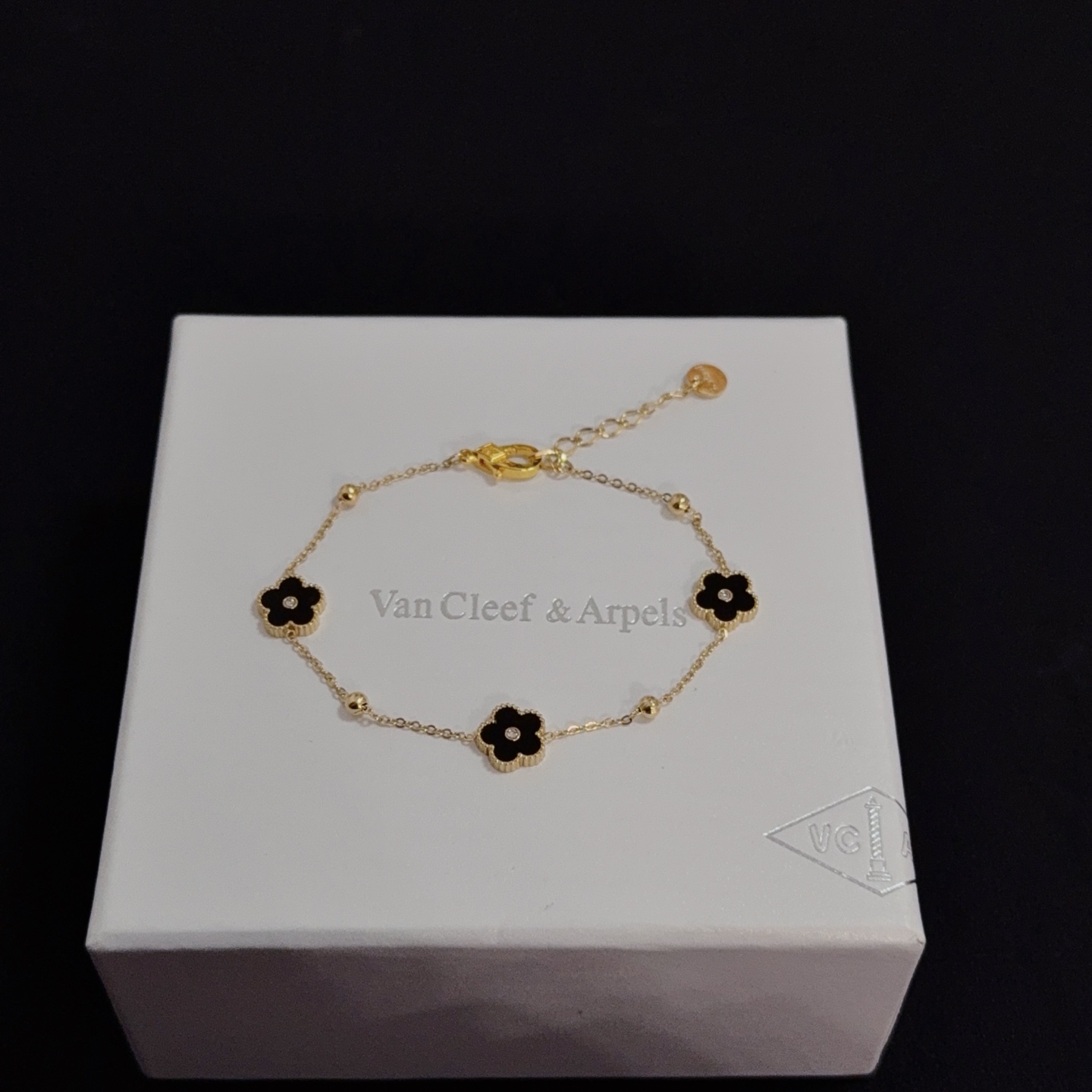 Van Cleef Arpels Alhambra bracelet yellow gold metal black onyx clover motifs clear diamond accents 17cm with 2cm extension chain