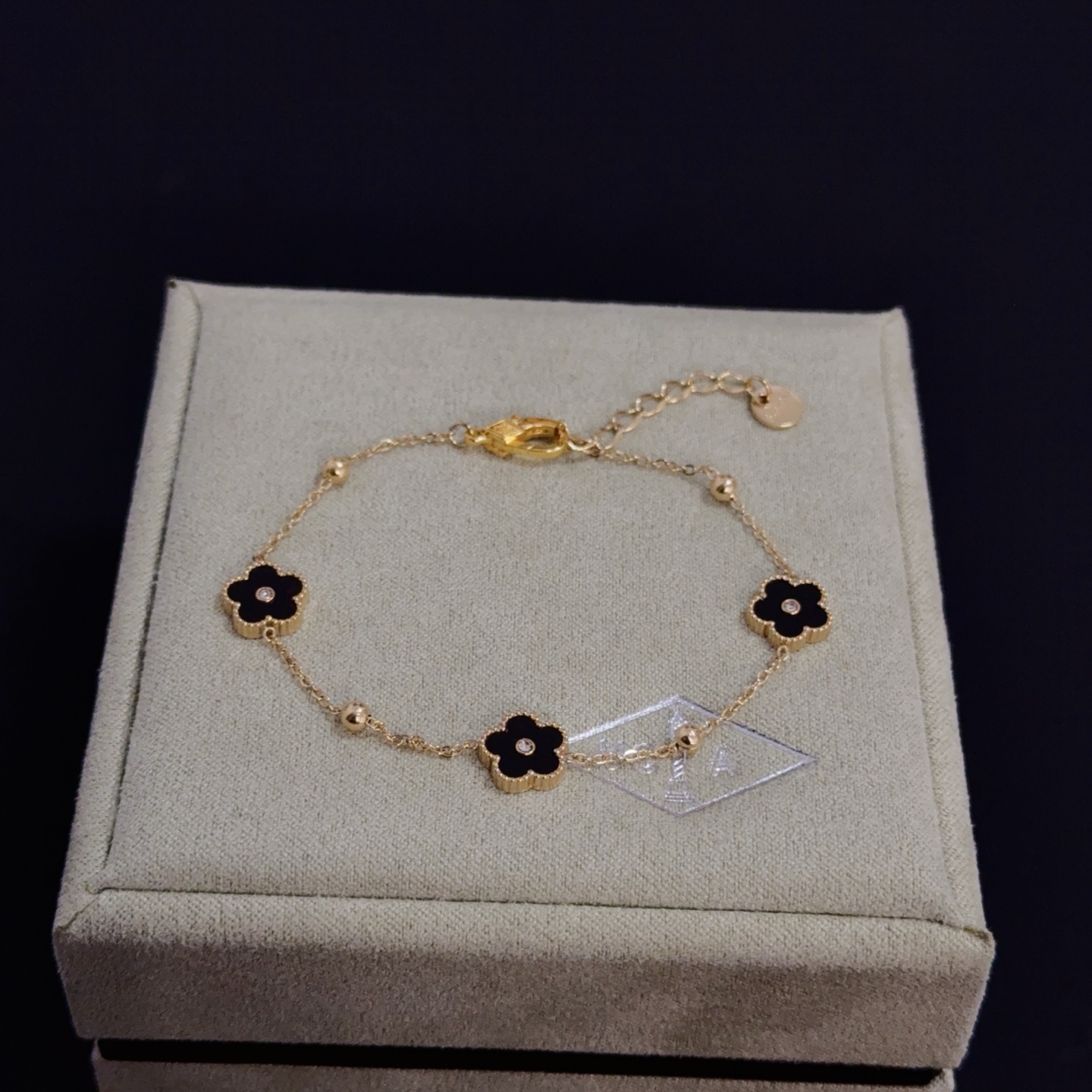 Van Cleef Arpels Alhambra bracelet yellow gold metal black onyx clover motifs clear diamond accents 17cm with 2cm extension chain