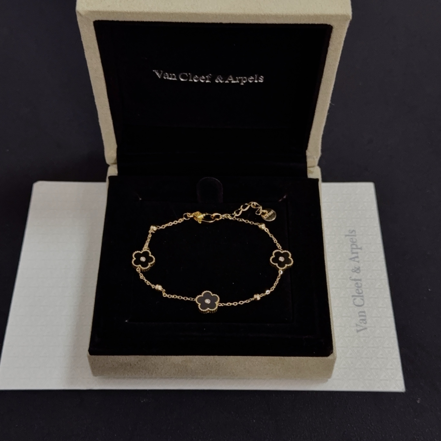 Van Cleef Arpels Alhambra bracelet yellow gold metal black onyx clover motifs clear diamond accents 17cm with 2cm extension chain