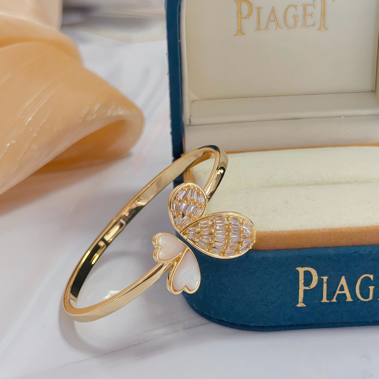 Piaget Butterfly bracelet gold-tone metal with white mother-of-pearl and clear baguette-cut stones 17cm