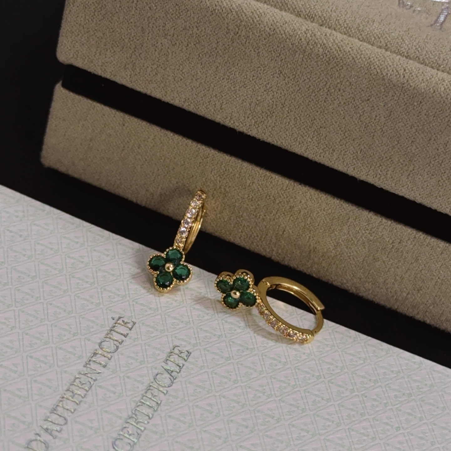 Van Cleef Arpels Alhambra earrings yellow gold metal with green gemstone clover motifs and clear diamond accents 10mm hoop diameter