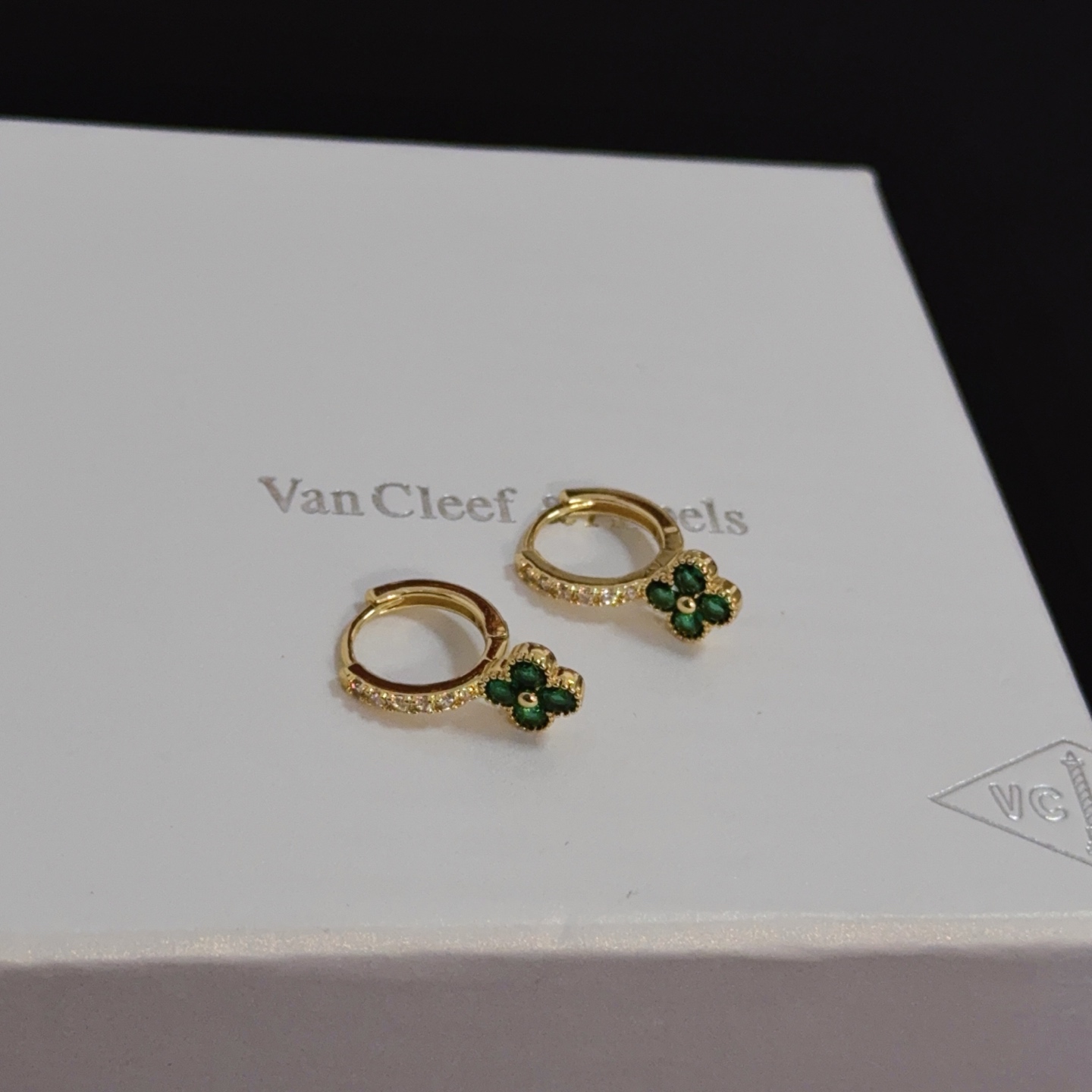 Van Cleef Arpels Alhambra earrings yellow gold metal with green gemstone clover motifs and clear diamond accents 10mm hoop diameter