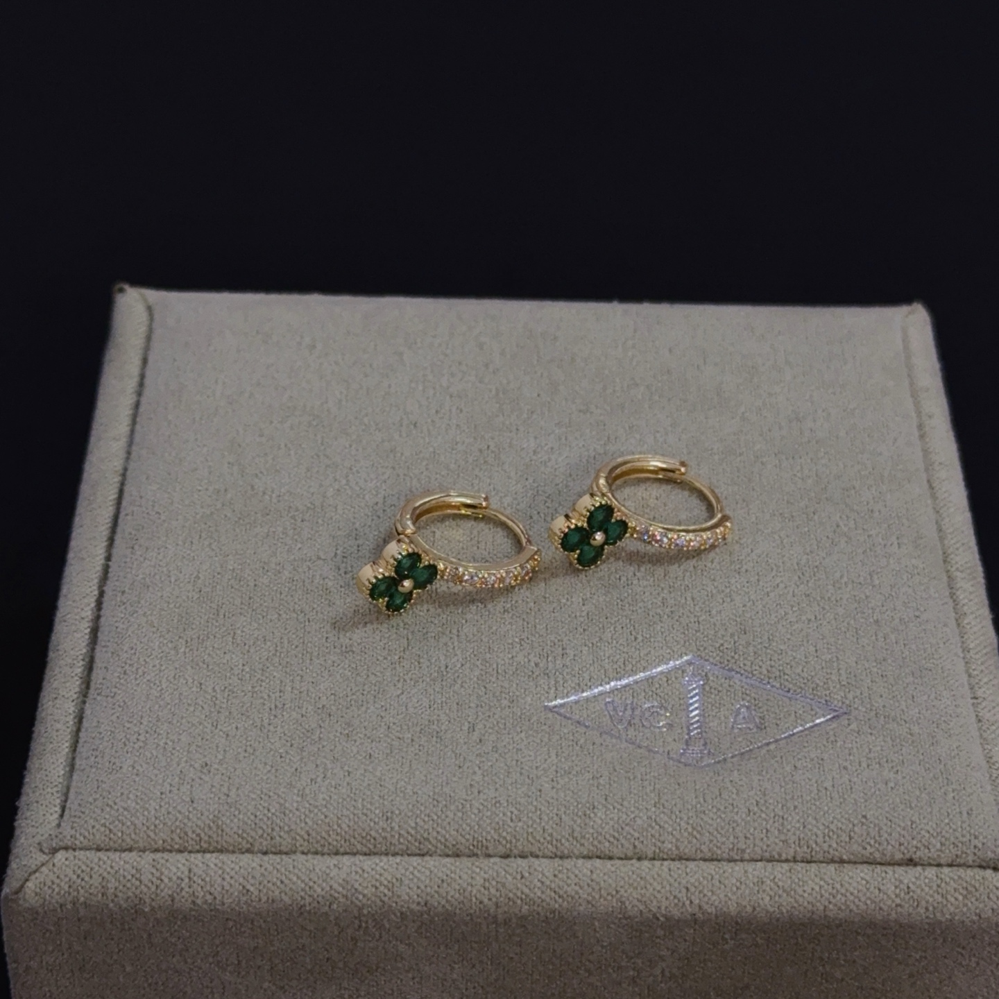 Van Cleef Arpels Alhambra earrings yellow gold metal with green gemstone clover motifs and clear diamond accents 10mm hoop diameter