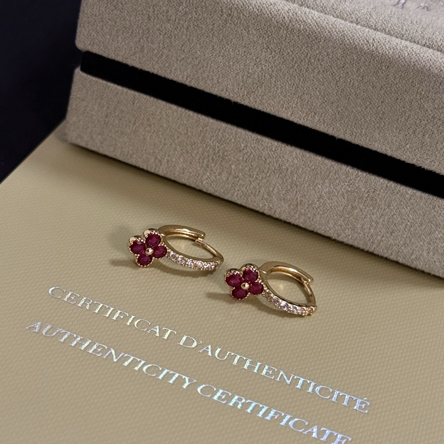 Van Cleef Arpels Alhambra earrings yellow gold metal ruby red clover stones clear diamond accent stones 10mm hoop diameter