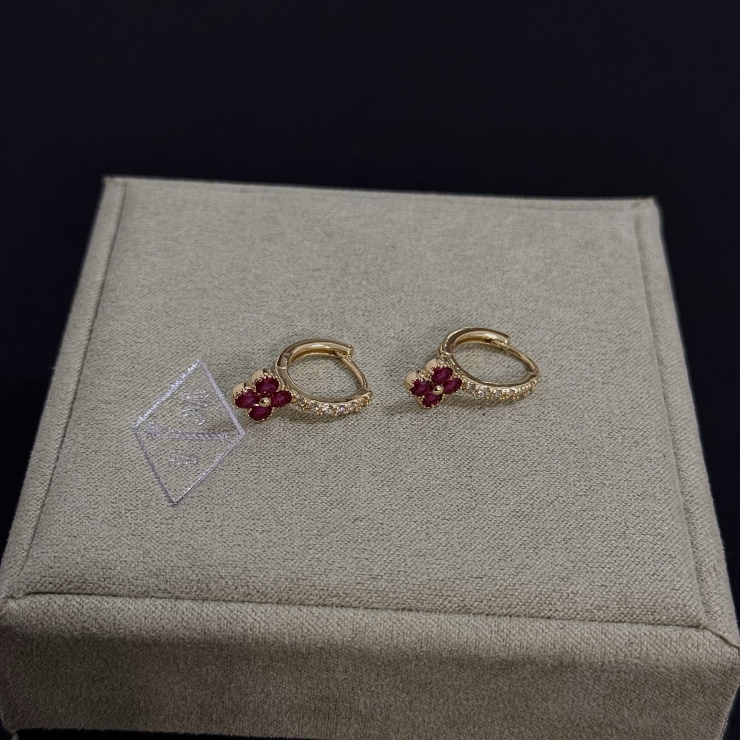 Van Cleef Arpels Alhambra earrings yellow gold metal ruby red clover stones clear diamond accent stones 10mm hoop diameter