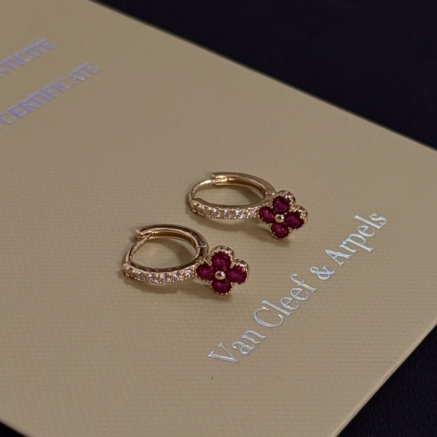 Van Cleef Arpels Alhambra earrings yellow gold metal ruby red clover stones clear diamond accent stones 10mm hoop diameter