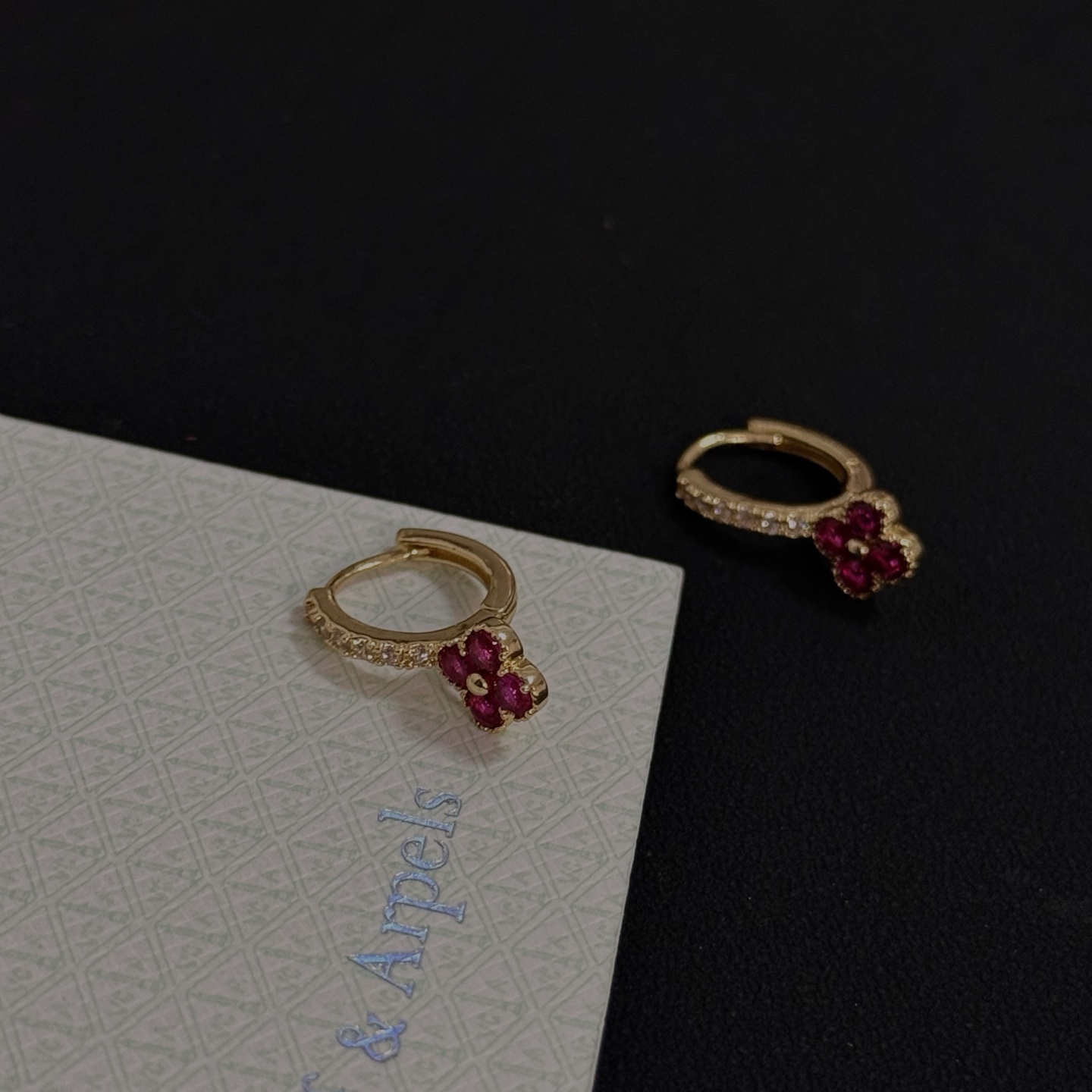 Van Cleef Arpels Alhambra earrings yellow gold metal ruby red clover stones clear diamond accent stones 10mm hoop diameter