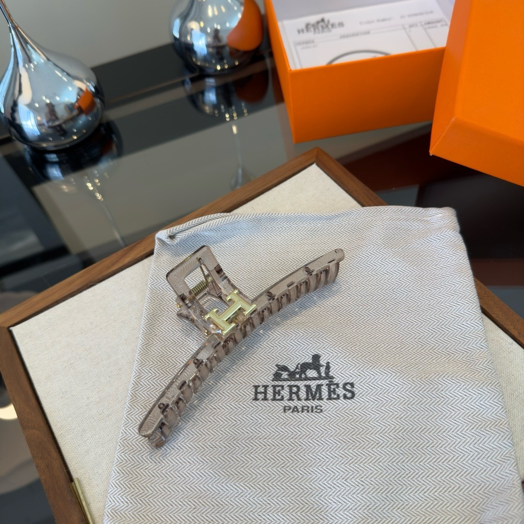 Spilla Hermes H Logo Hair Claw Resina color talpa trasparente metallo color oro 11 cm