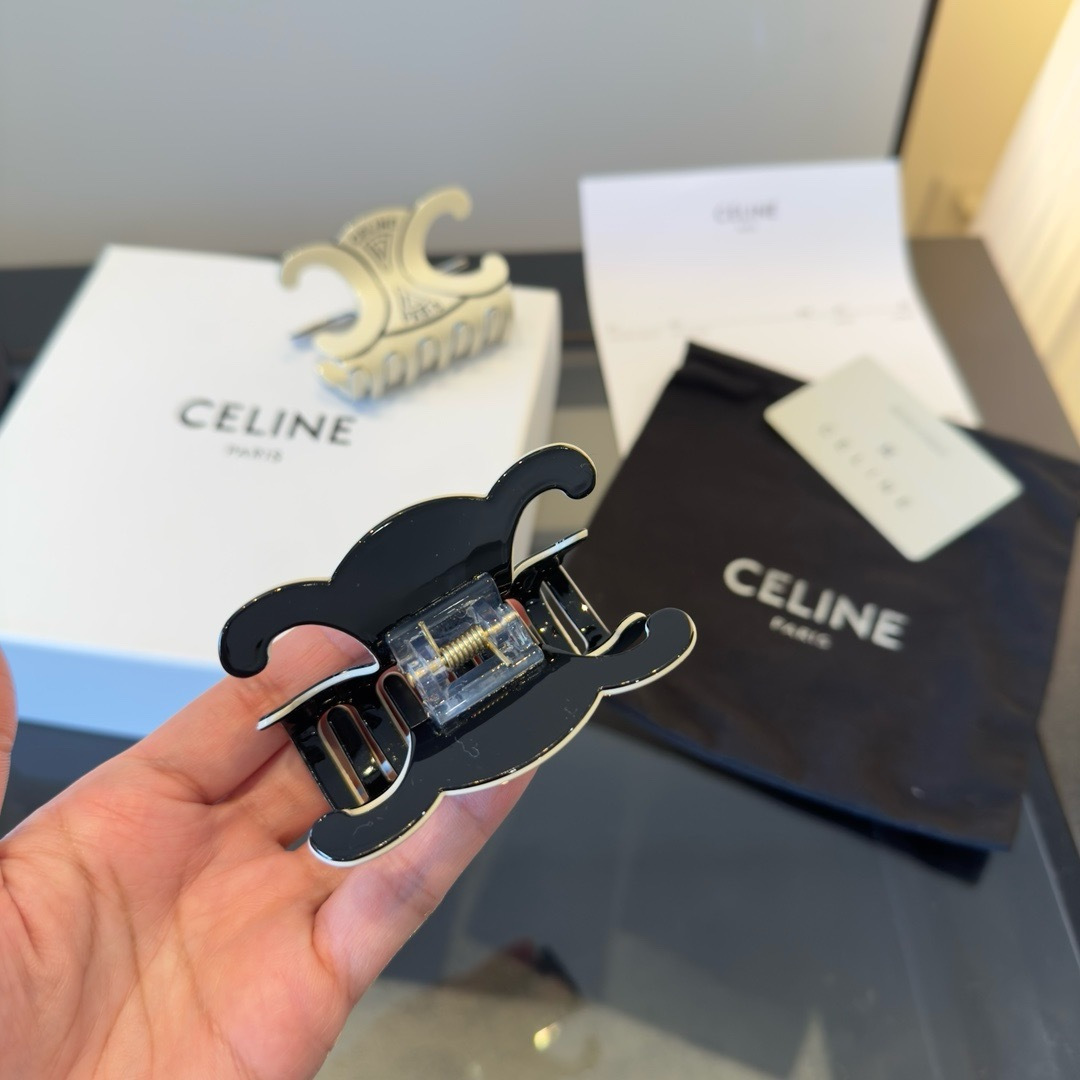 Celine Triomphe Paris Hair Claw brooch Black enamel with gold-tone metal accents Ivory enamel with gold-tone metal accents 6cm