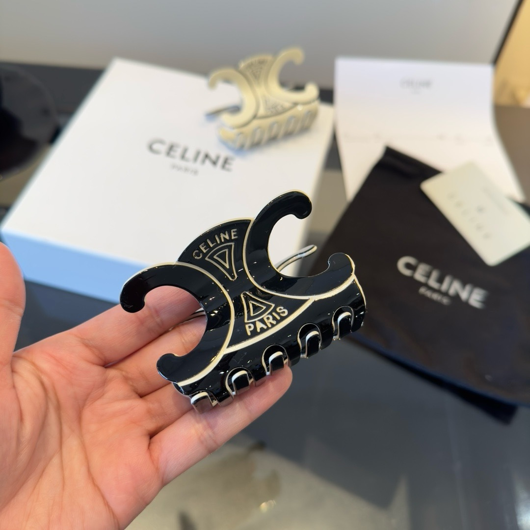 Celine Triomphe Paris Hair Claw brooch Black enamel with gold-tone metal accents Ivory enamel with gold-tone metal accents 6cm