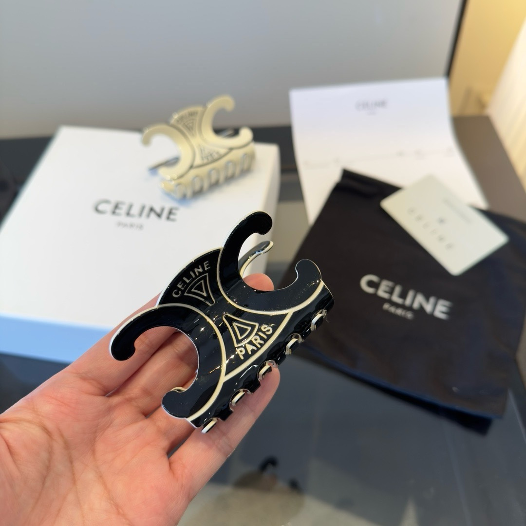 Celine Triomphe Paris Hair Claw brooch Black enamel with gold-tone metal accents Ivory enamel with gold-tone metal accents 6cm