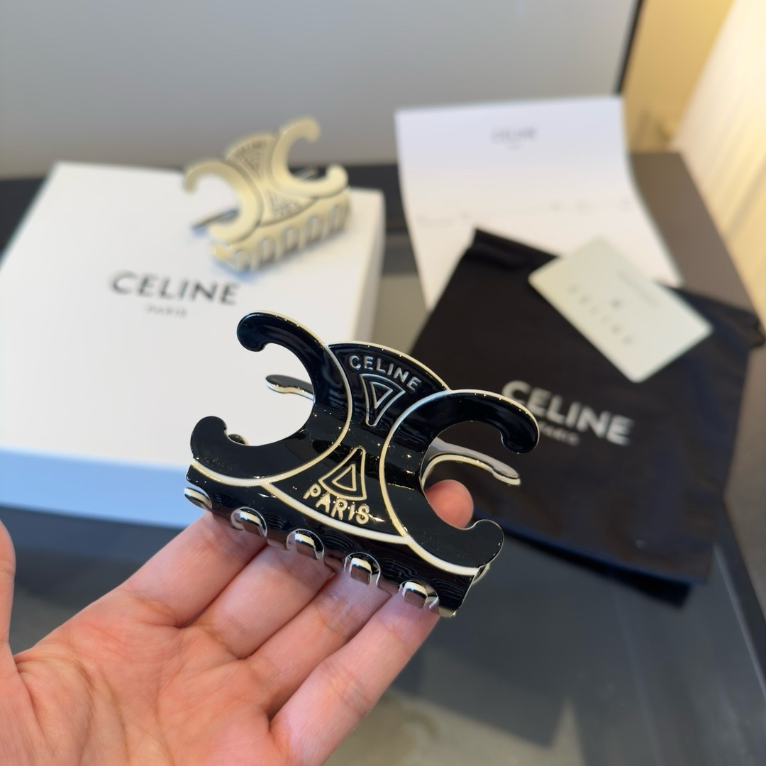 Celine Triomphe Paris Hair Claw brooch Black enamel with gold-tone metal accents Ivory enamel with gold-tone metal accents 6cm