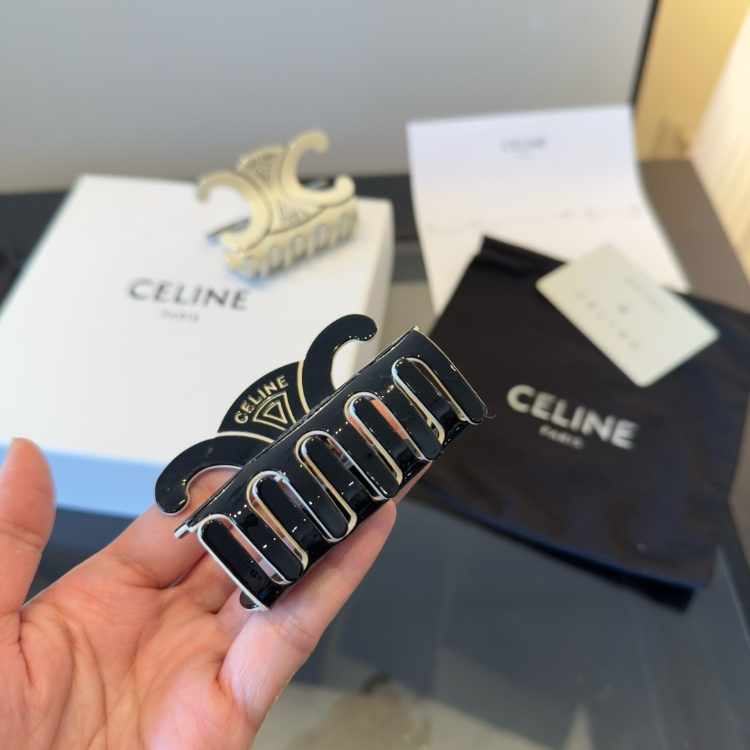 Celine Triomphe Paris Hair Claw brooch Black enamel with gold-tone metal accents Ivory enamel with gold-tone metal accents 6cm