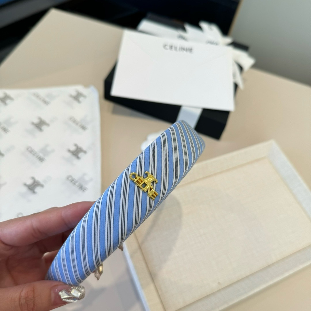 Celine Triomphe Padded Striped Headband brooch Light blue white gray striped fabric with gold-tone Triomphe logo hardware One Size standard headband width 3cm circumference 40cm