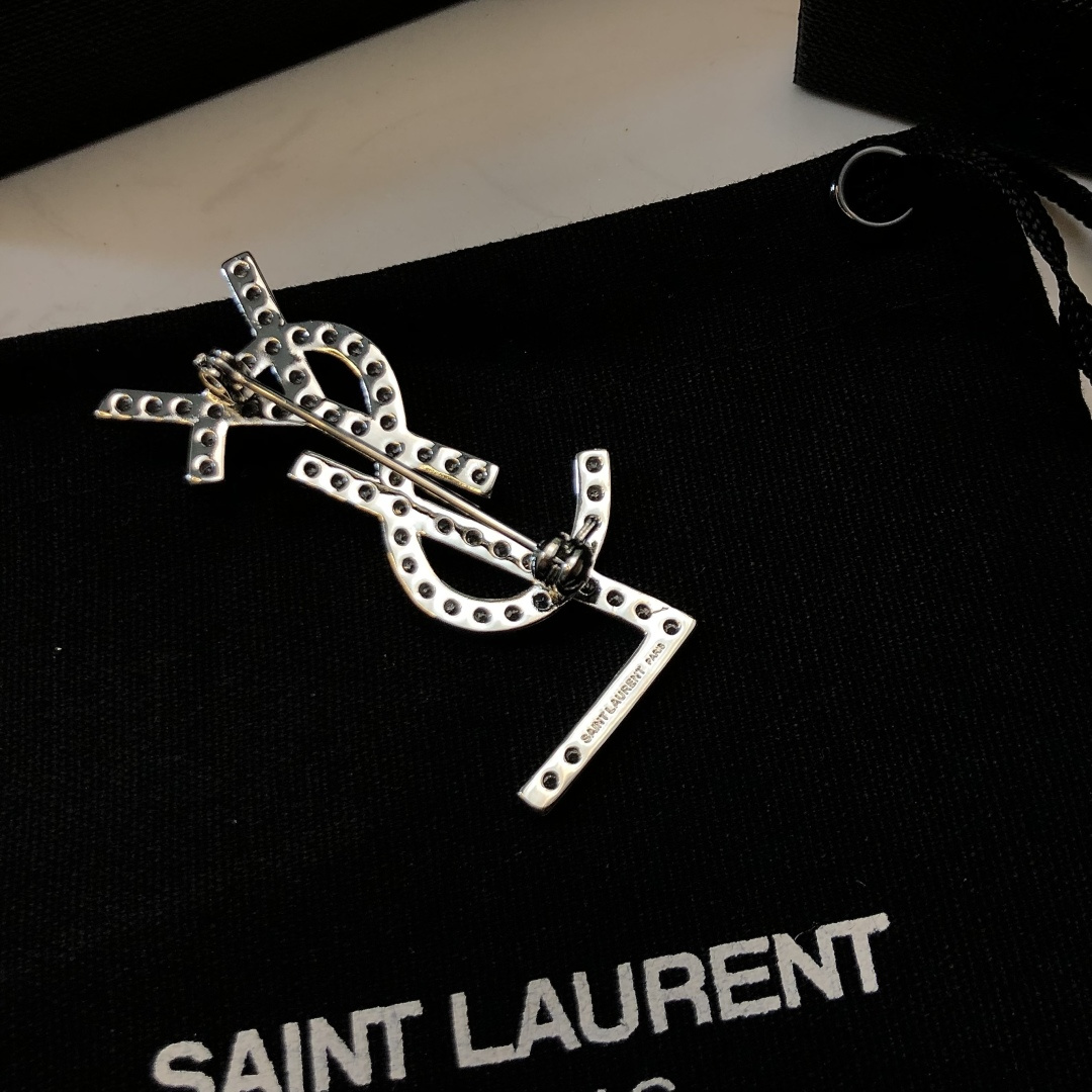 Saint Laurent YSL Monogram Crystal Brooch brooch silver-toned metal with clear crystal accents 3 5cm