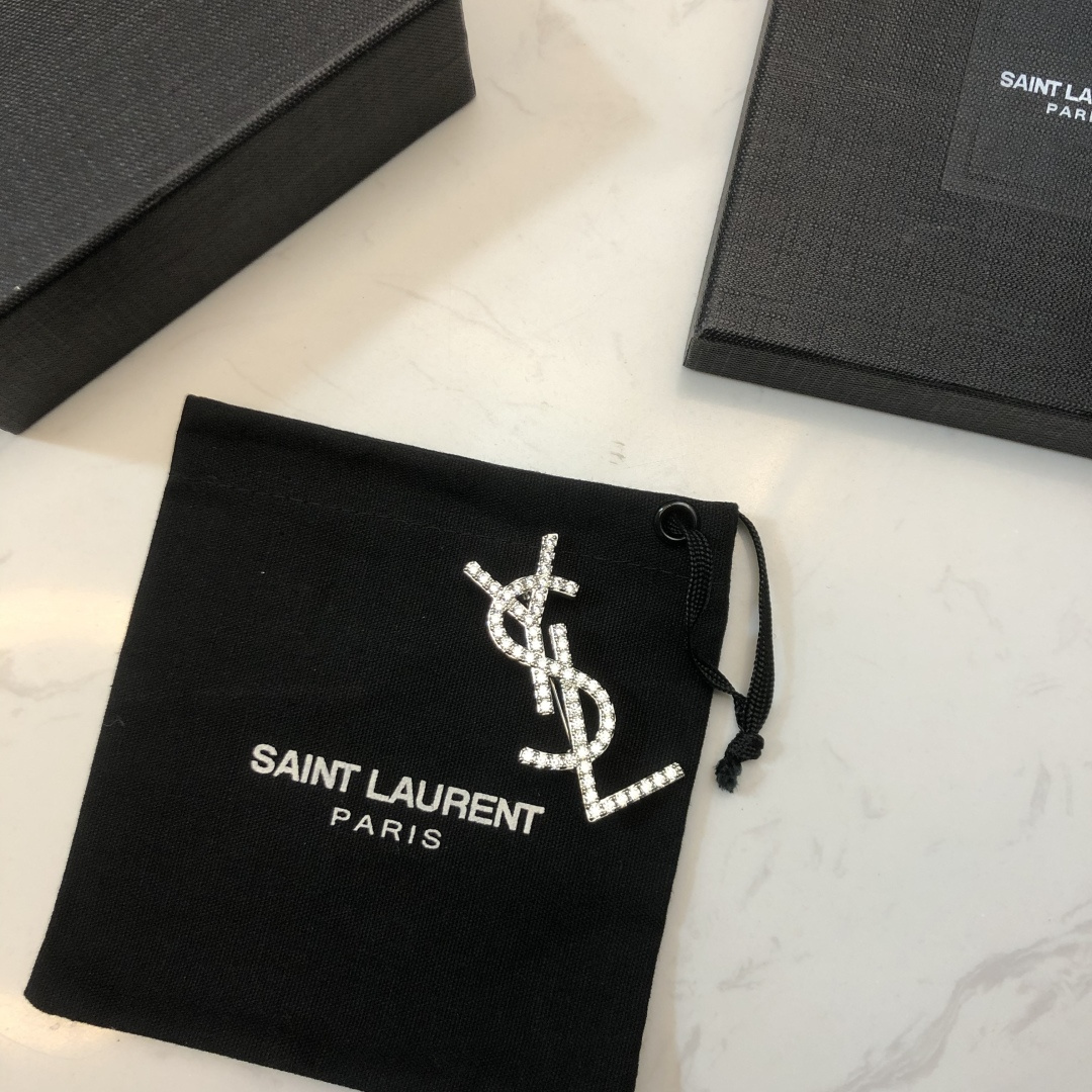 Saint Laurent YSL Monogram Crystal Brooch brooch silver-toned metal with clear crystal accents 3 5cm