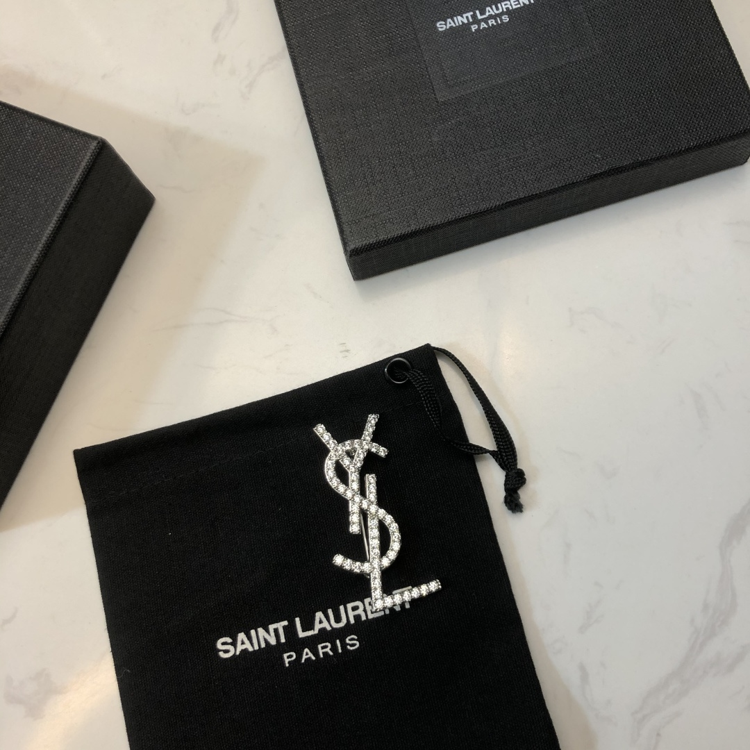 Saint Laurent YSL Monogram Crystal Brooch brooch silver-toned metal with clear crystal accents 3 5cm