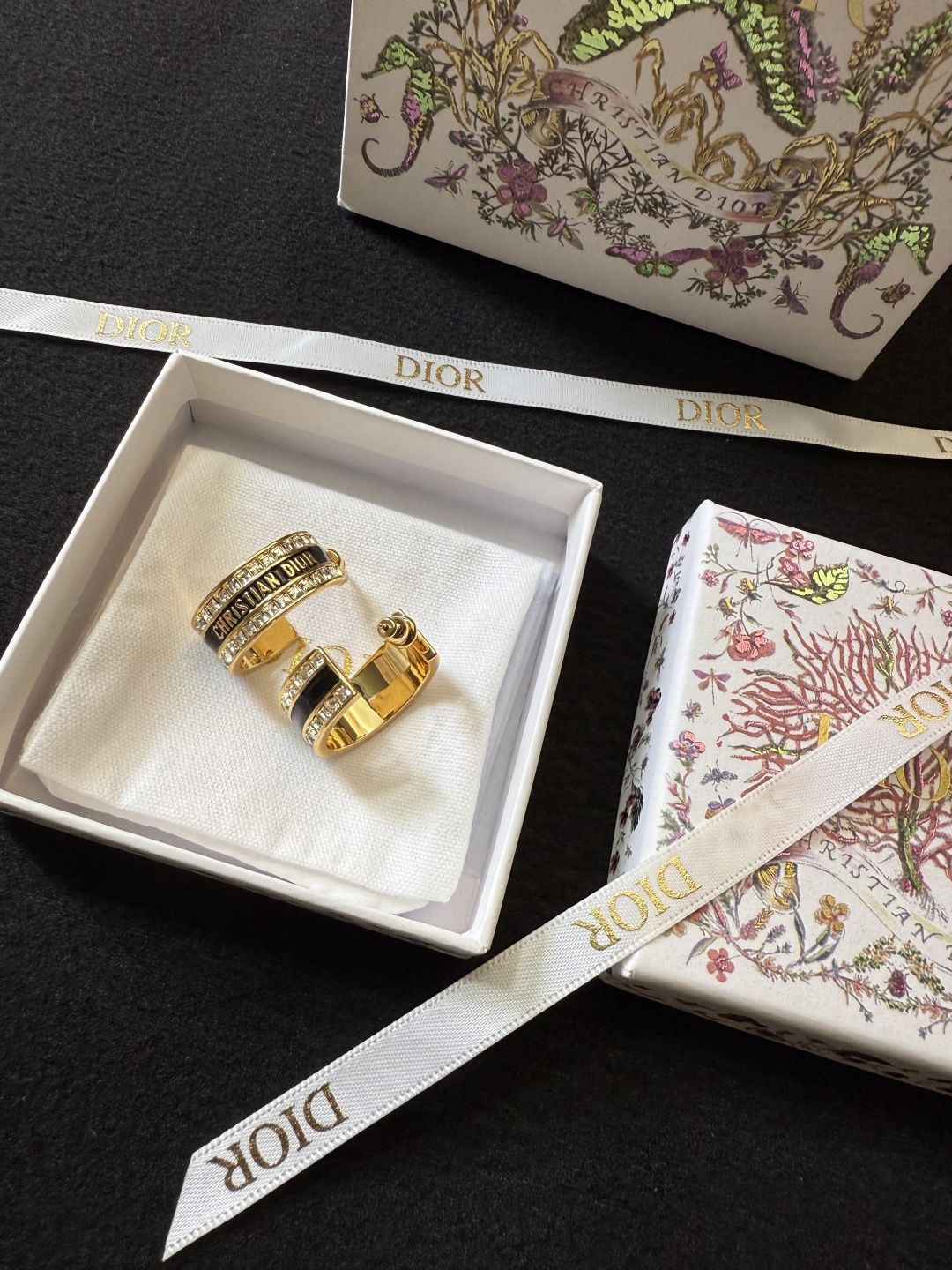 Dior Dior Code earrings gold-tone metal with clear crystal accents available with black or white enamel bands 1 5cm hoop diameter