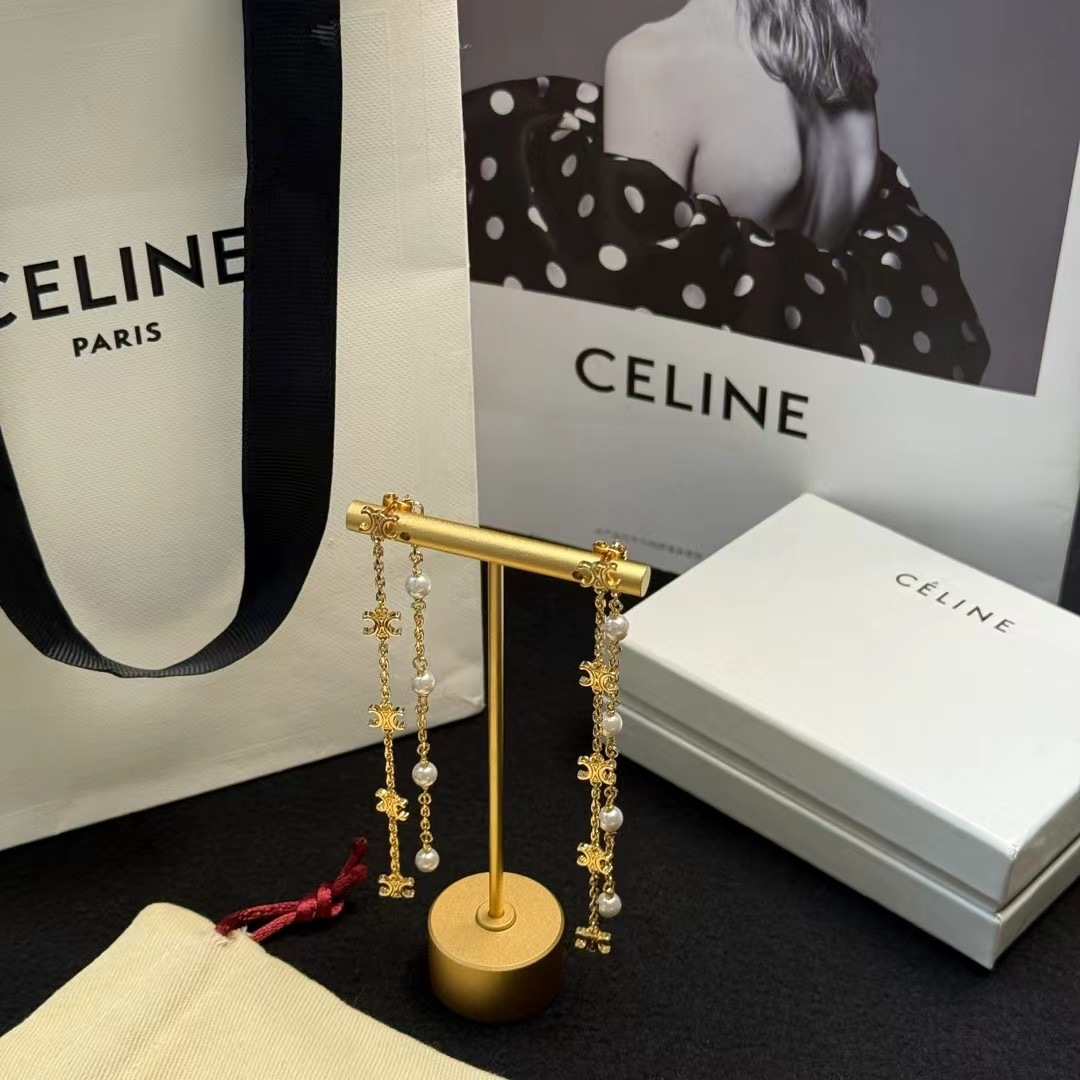 Celine Triomphe Pearl Long Chain Drop Earrings earrings Gold-tone metal with white pearl accents Approximately 7cm drop length