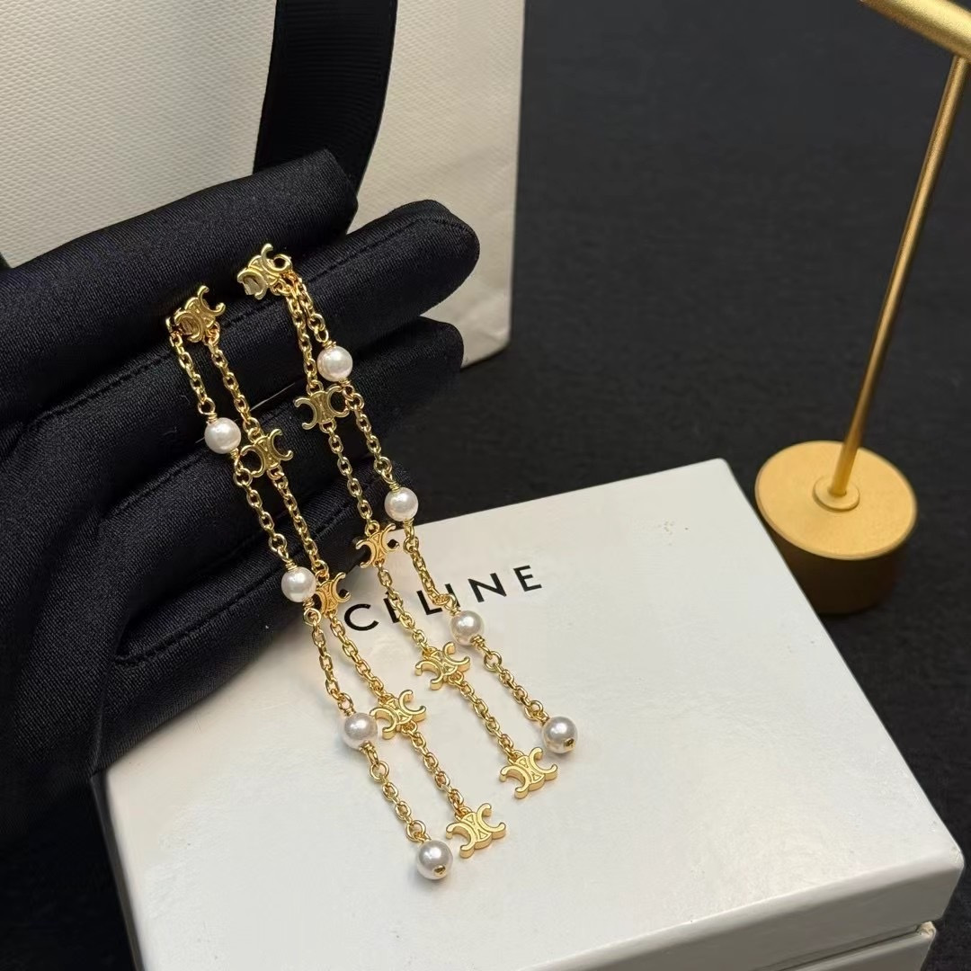 Celine Triomphe Pearl Long Chain Drop Earrings earrings Gold-tone metal with white pearl accents Approximately 7cm drop length