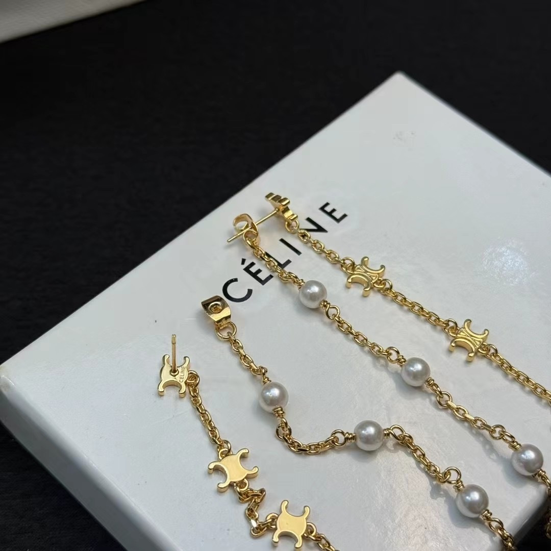 Celine Triomphe Pearl Long Chain Drop Earrings earrings Gold-tone metal with white pearl accents Approximately 7cm drop length