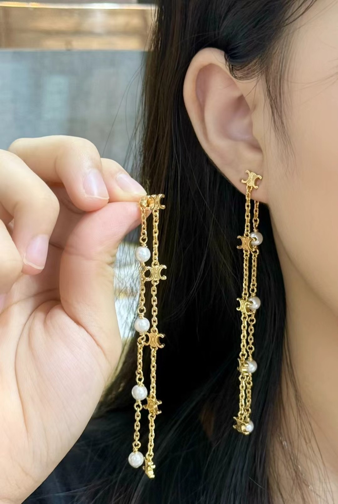 Celine Triomphe Pearl Long Chain Drop Earrings earrings Gold-tone metal with white pearl accents Approximately 7cm drop length