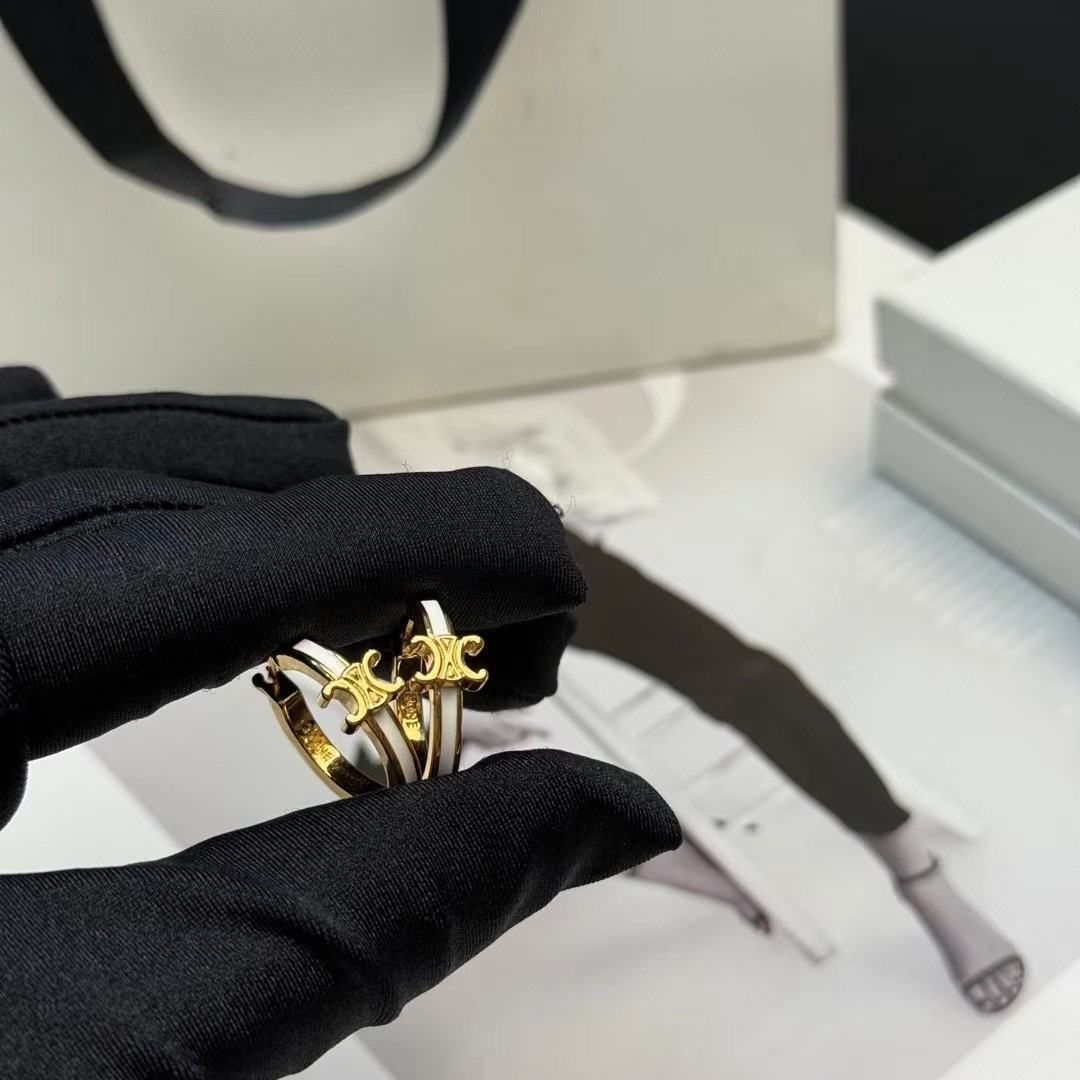 Celine Triomphe earrings gold-tone metal with white enamel accents 1 5cm hoop diameter