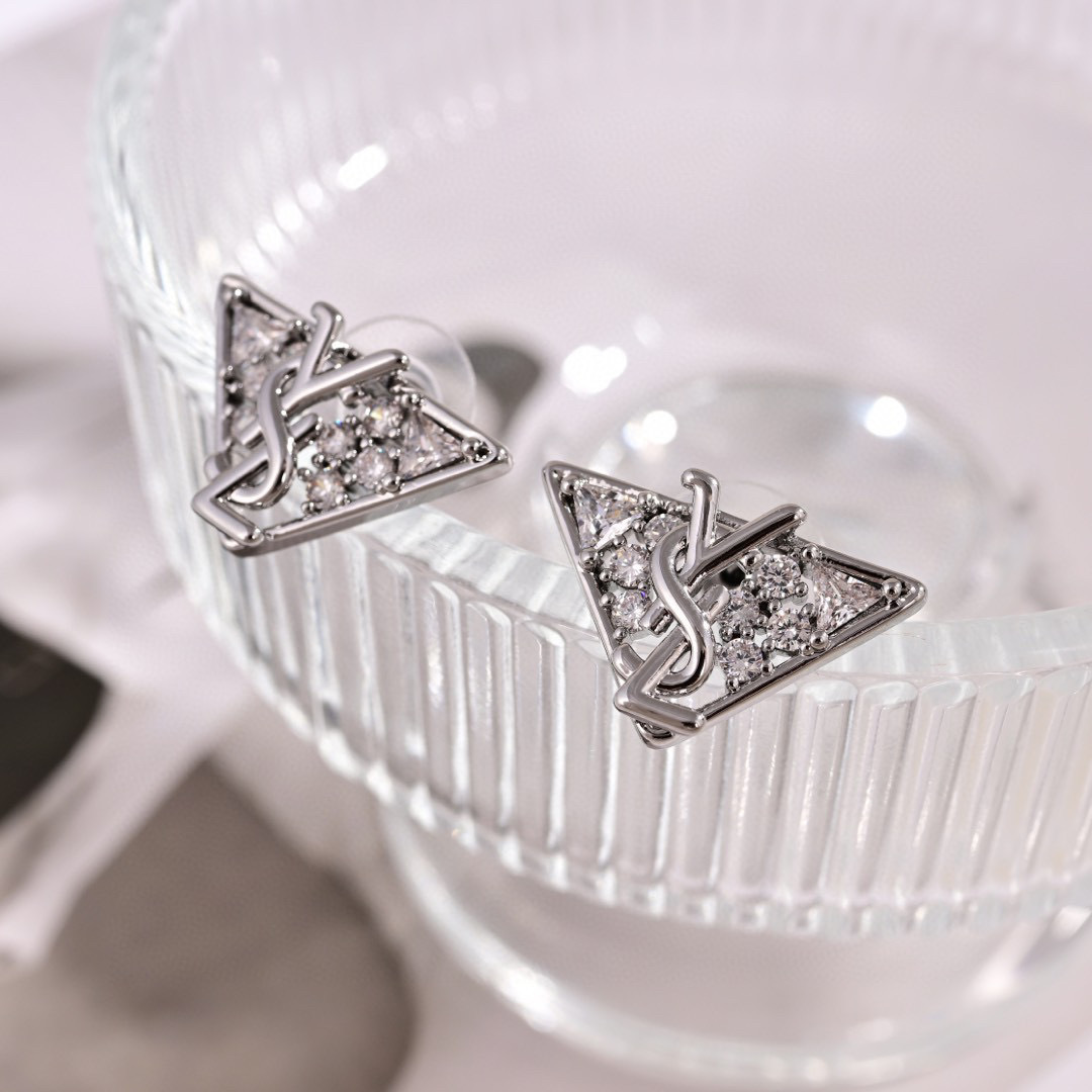 Saint Laurent YSL 1961 Triangle Monogram earrings Gold-tone metal with clear cubic zirconia Silver-tone metal with clear cubic zirconia 1 5cm stud length