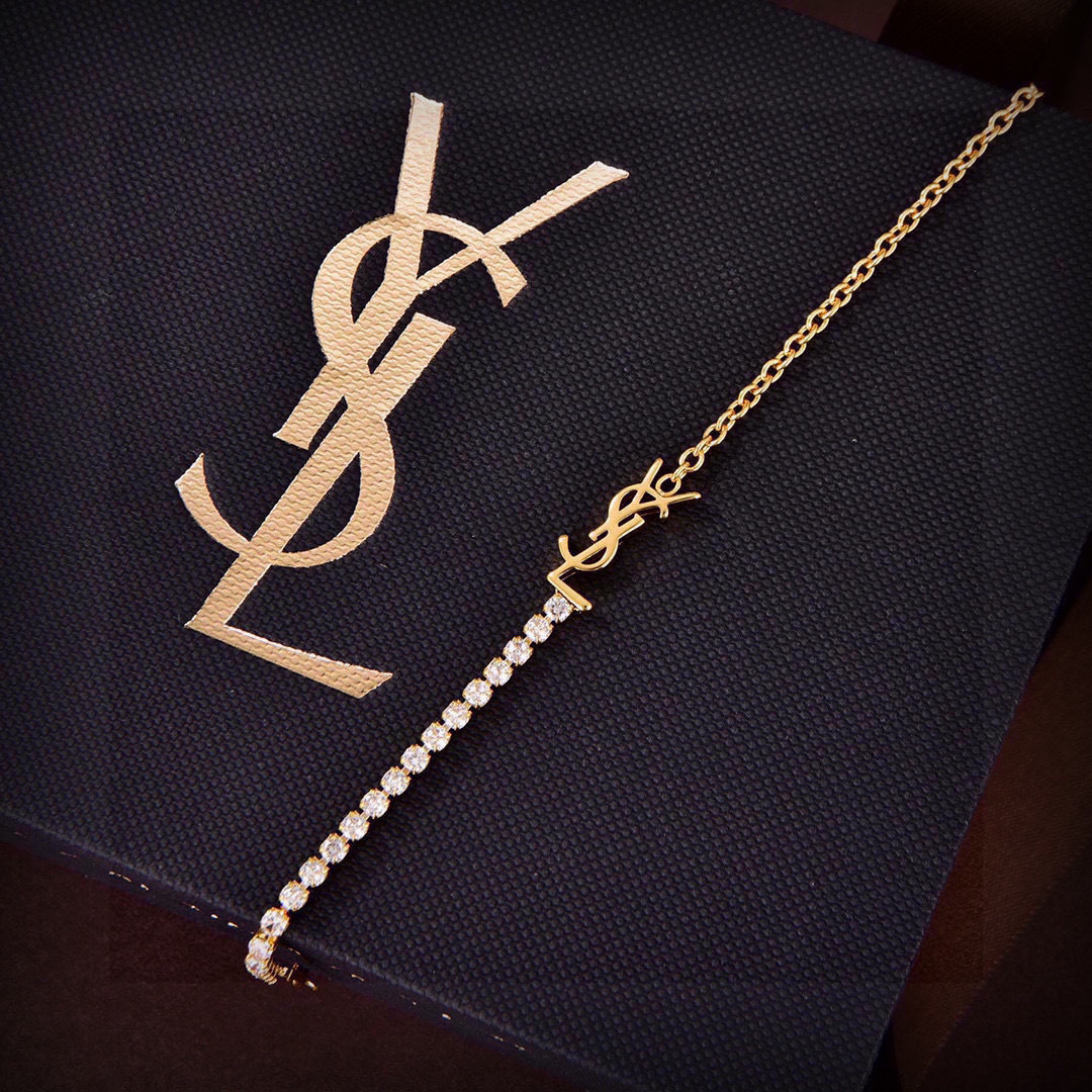 Saint Laurent Cassandre YSL Crystal Tennis Bracelet bracelet gold-tone metal with clear faceted crystals 18cm with 3cm extension chain
