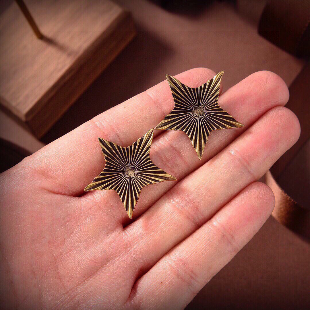 Saint Laurent 1961 Star Stud Earrings earrings Antique gold-tone metal with dark oxidized radial detailing no gemstones One Size approx 2 5cm width per earring