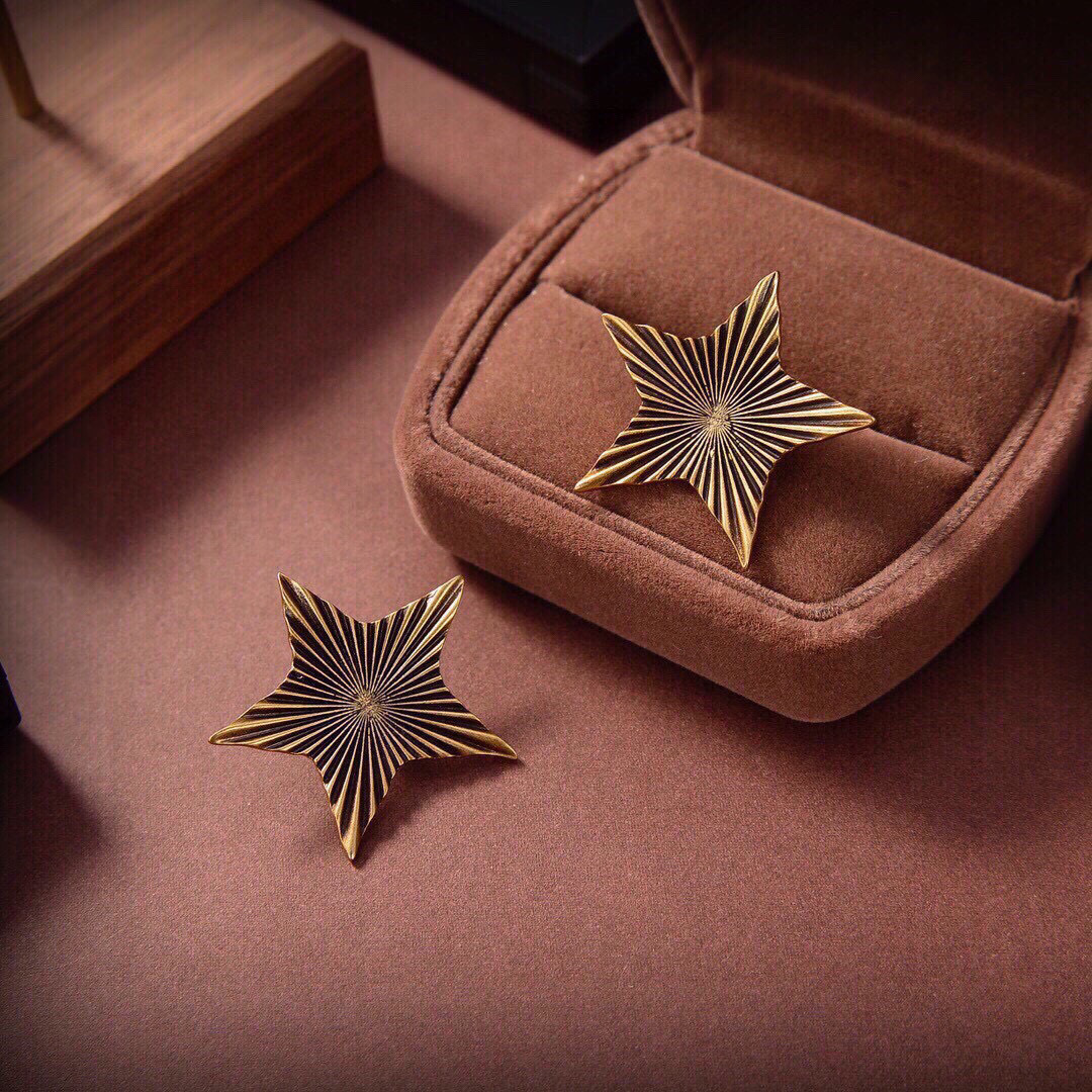 Saint Laurent 1961 Star Stud Earrings earrings Antique gold-tone metal with dark oxidized radial detailing no gemstones One Size approx 2 5cm width per earring