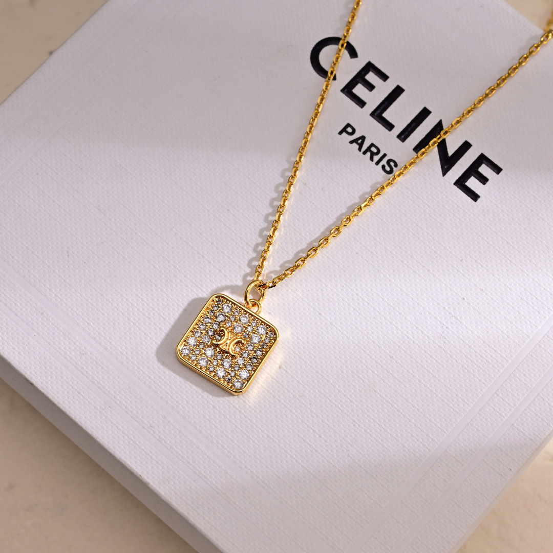 Celine Triomphe Nightfall earrings gold-tone metal with clear crystal accents 2 5cm drop length
