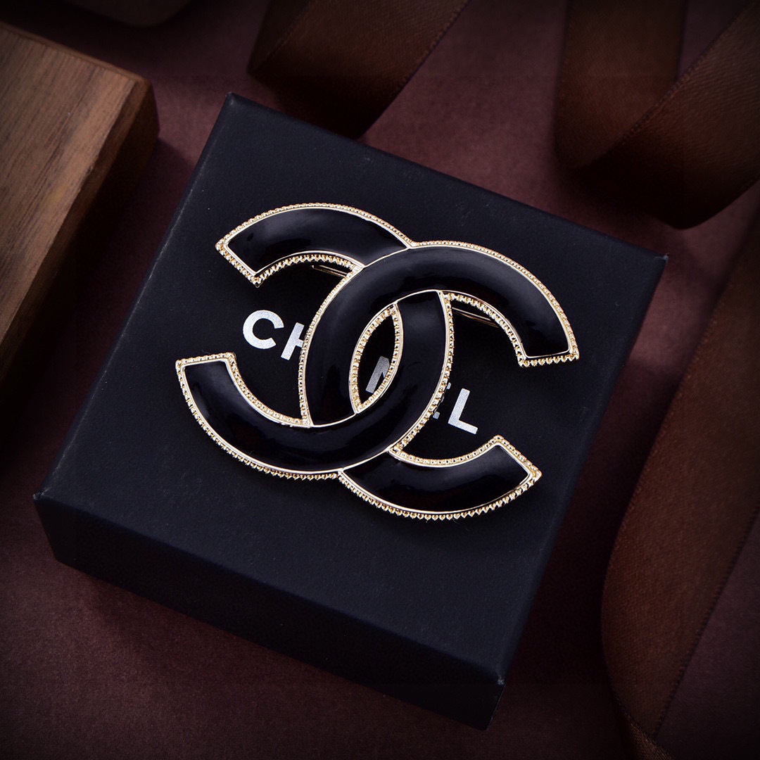 Chanel CC Logo Enamel Brooch brooch Gold-tone metal with black enamel and white enamel options 4 5cm width
