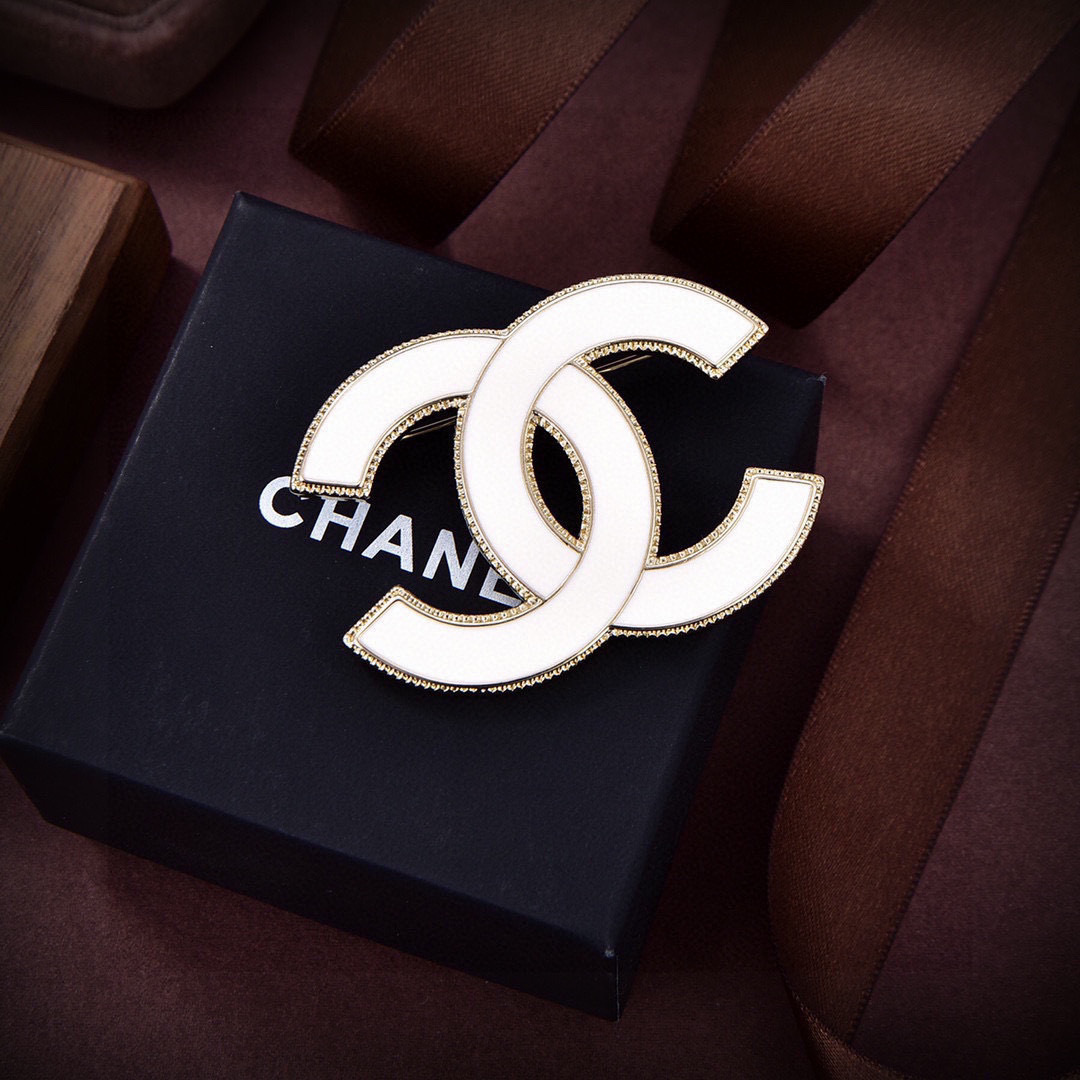 Chanel CC Logo Enamel Brooch brooch Gold-tone metal with black enamel and white enamel options 4 5cm width